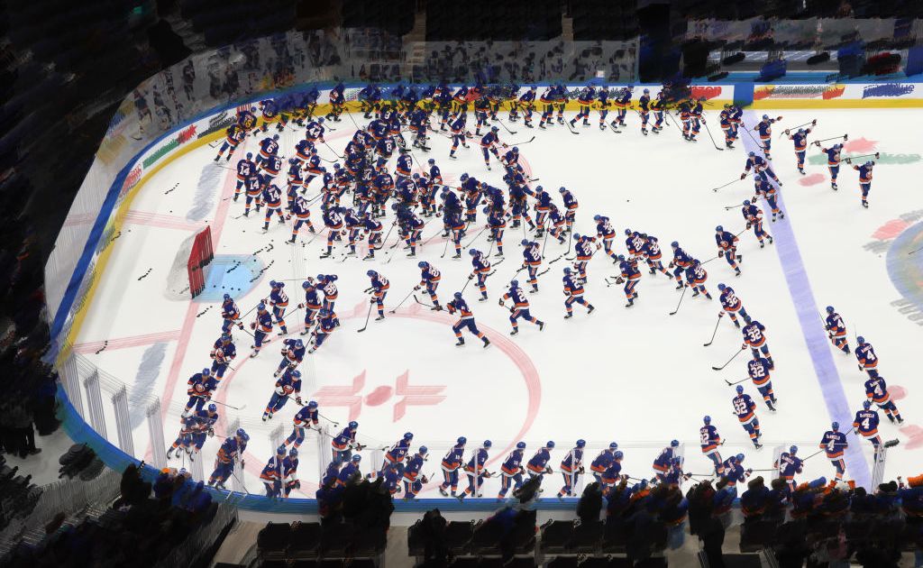 ELMONT, NEW YORK - MARCH 04: (EDITORS NOTE: This image was created using in-camera multiple exposure). The New York Islanders skate in warmups prior to the game against the Winnipeg Jets at UBS Arena on March 04, 2025 in Elmont, New York.