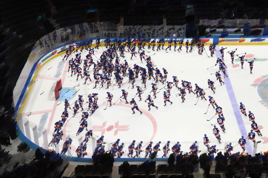 ELMONT, NEW YORK - MARCH 04: (EDITORS NOTE: This image was created using in-camera multiple exposure). The New York Islanders skate in warmups prior to the game against the Winnipeg Jets at UBS Arena on March 04, 2025 in Elmont, New York.