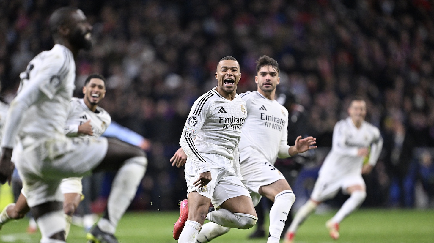 Real Madrid players celebrate at the end of the UEFA Champions League Round of 16 second-leg match between Atletico Madrid and Real Madrid at Riyadh Air Metropolitano Stadium in Madrid, Spain on March 12, 2025. Real Madrid won in a penalty shootout.