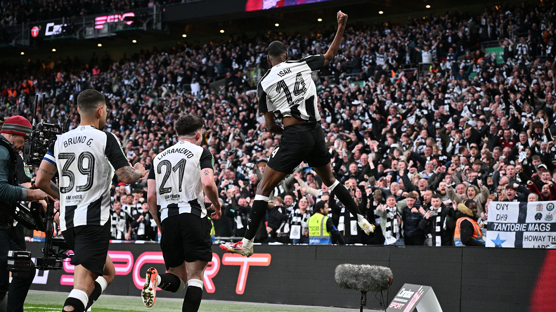 Alexander Isak of Newcastle United F.C. celebrate with fans after scoring the second goal during the Carabao Cup Final between Liverpool and Newcastle United at Wembley Stadium on March 16, 2025 in London, England.