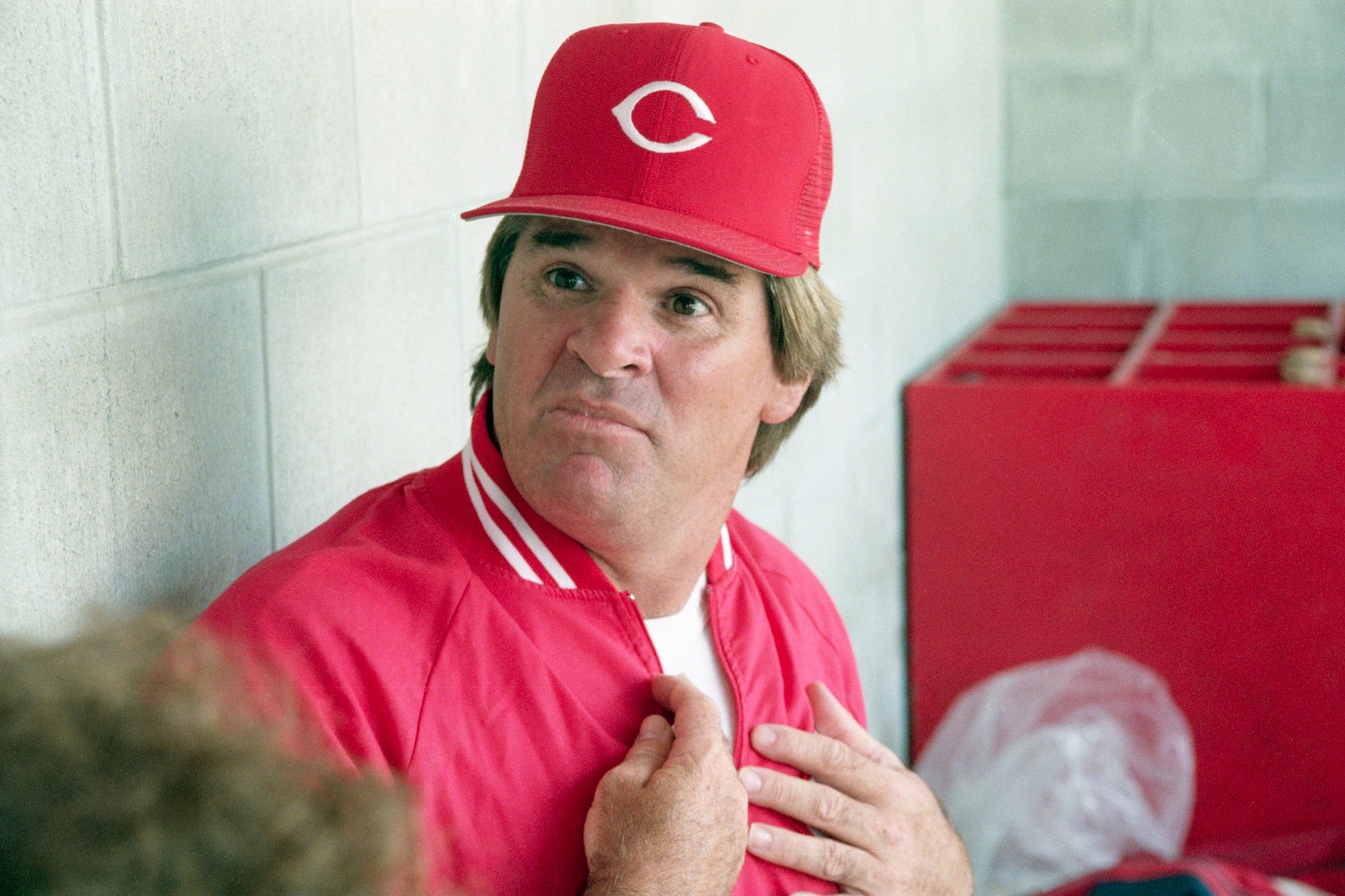 (Original Caption) 3/22/1989-Plant City, FL-Cincinnati Reds' manager Pete Rose reacts to a reporters question 3/22 in the dugout prior to their contest against the Cards. Rose is under scrutiny by the baseball commissioners office for gambling.