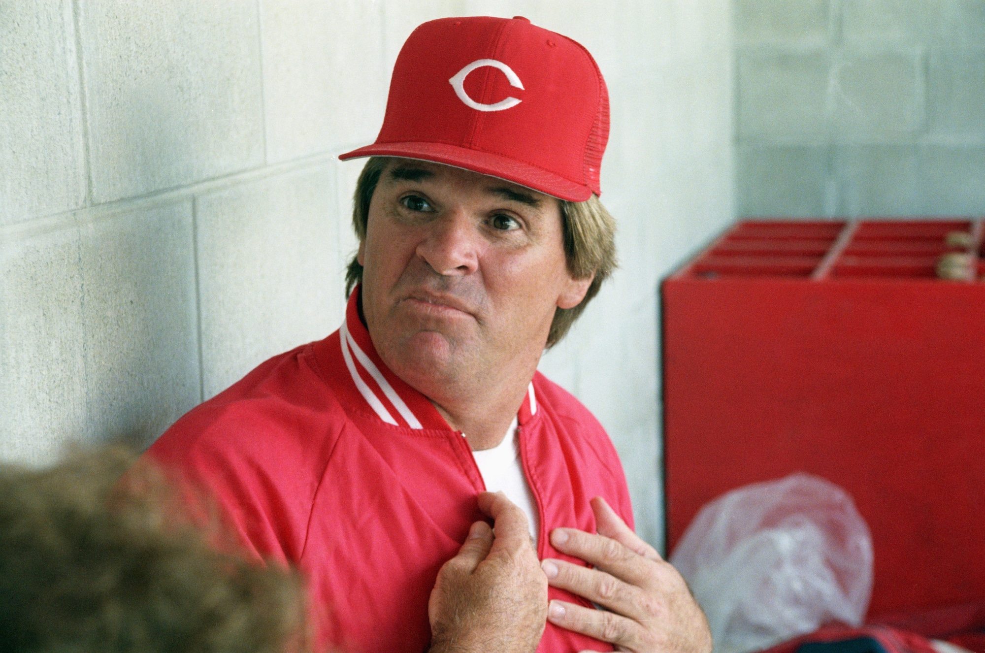 (Original Caption) 3/22/1989-Plant City, FL-Cincinnati Reds' manager Pete Rose reacts to a reporters question 3/22 in the dugout prior to their contest against the Cards. Rose is under scrutiny by the baseball commissioners office for gambling.