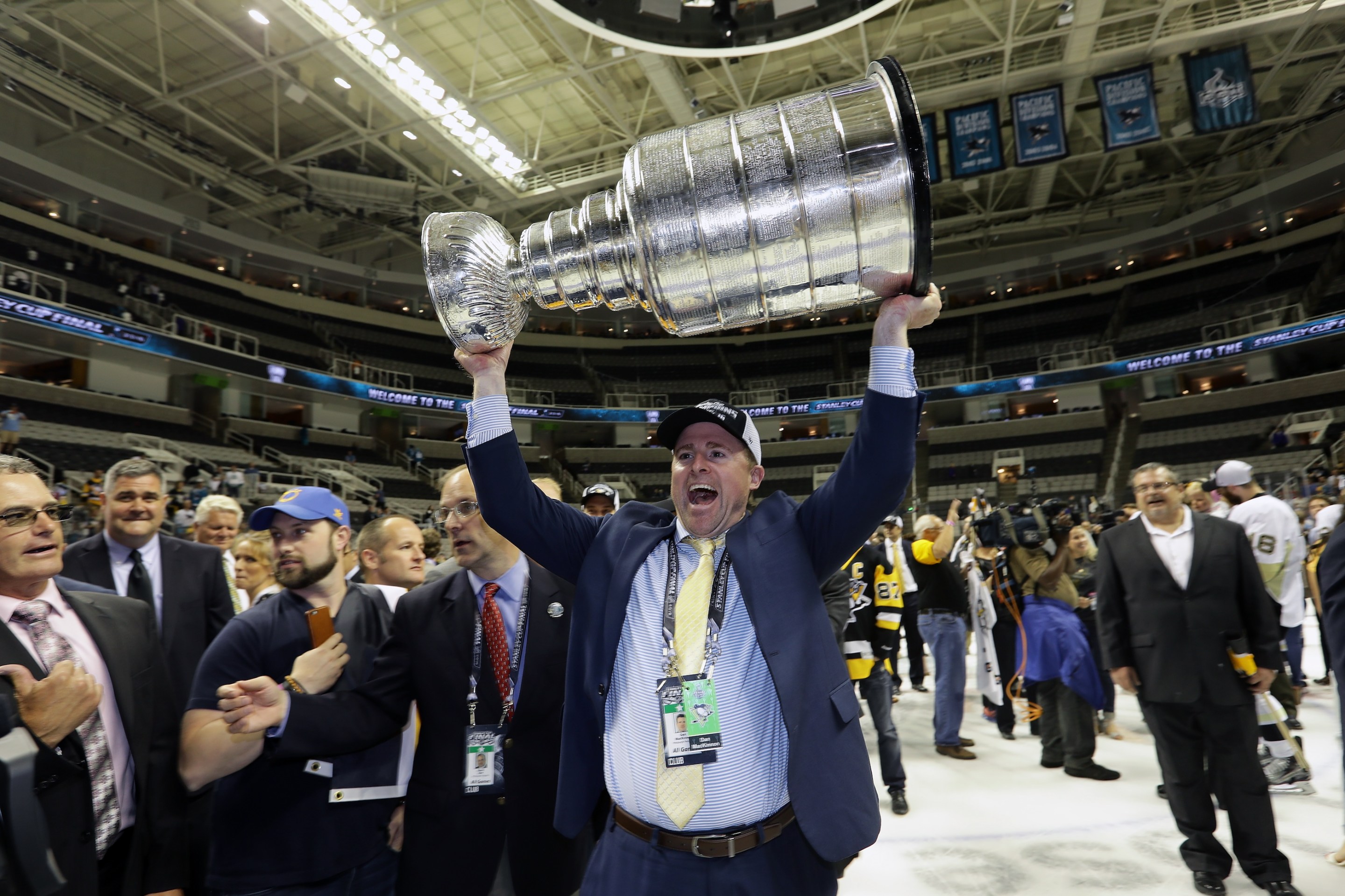 Dan MacKinnon of the Pittsburgh Penguins celebrates by hoisting the Stanley Cup after his teams 3-1 victory to win the Stanley Cup in 2016. This is not a photo of him after trading his son to the Columbus Blue Jackets for future considerations.