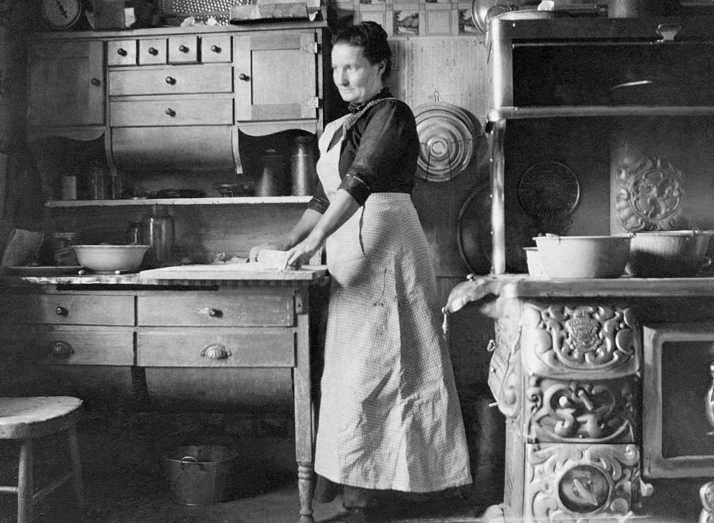 A woman rolls dough