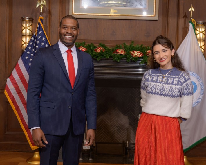 fired EPA program analyst Amanda Cronin posing with Michael Regan, the 16th administrator of the EPA who served under Joe Biden