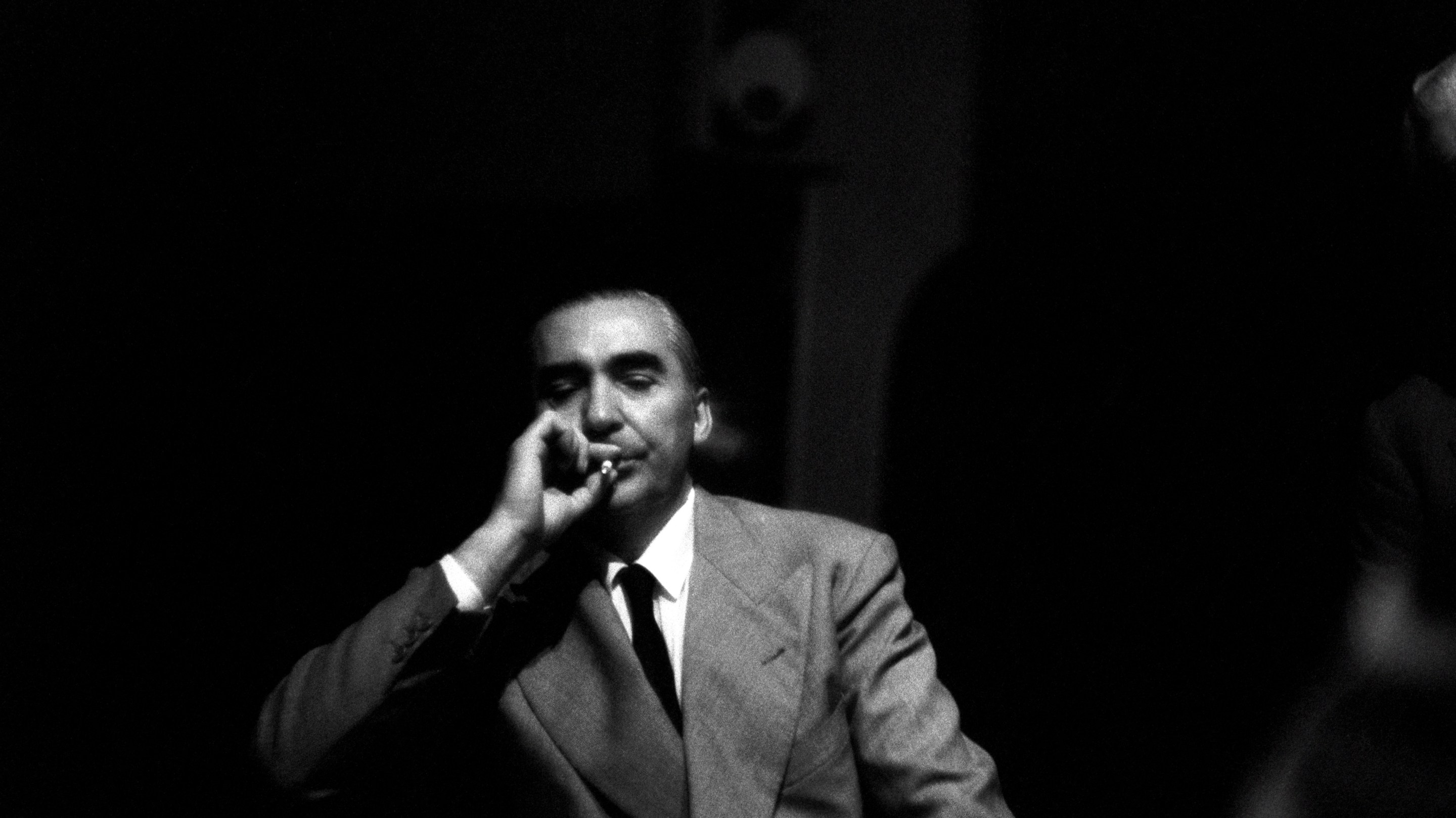 Curzio Malaparte smokes a cigarette