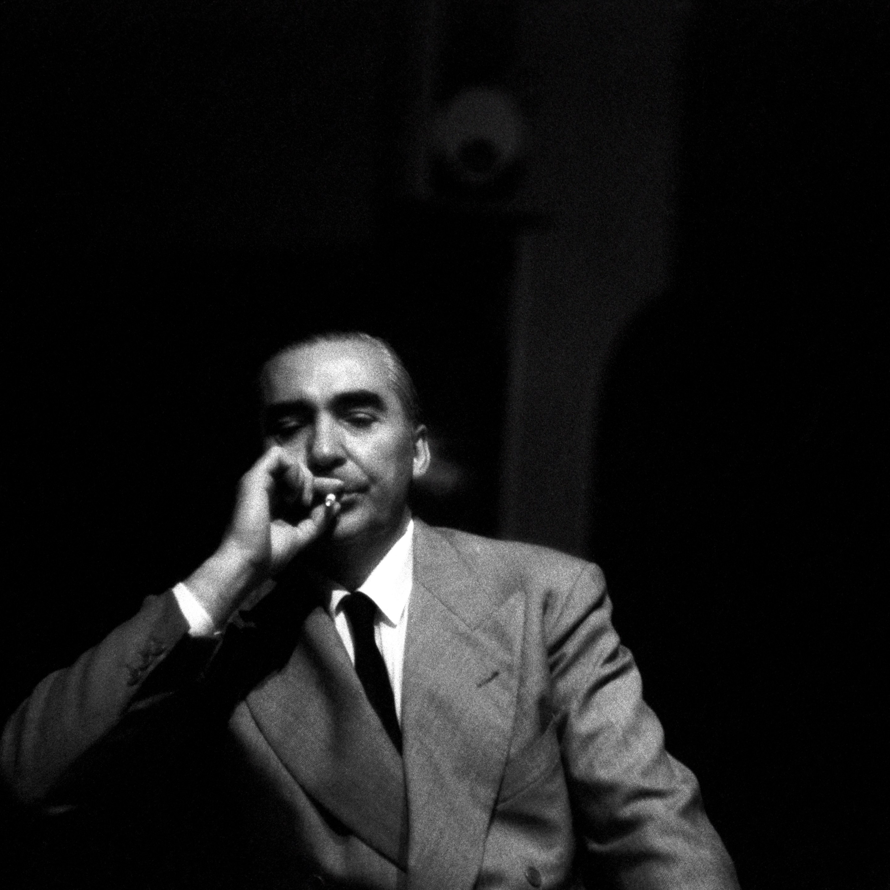 Curzio Malaparte smokes a cigarette