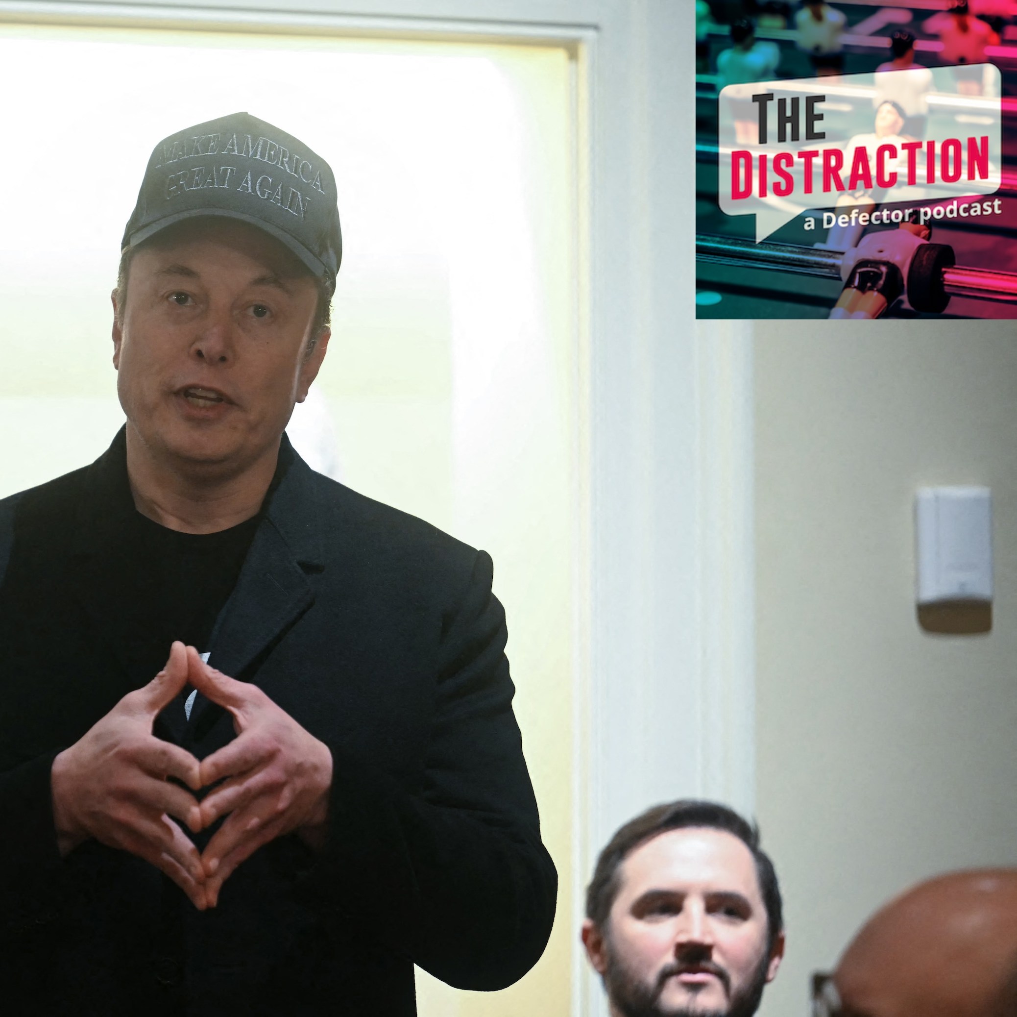 Elon Musk speaks during a cabinet meeting with US President Donald Trump at the White House in Washington, DC, on February 26, 2025. He's backlit and is doing his Thinking Hands and is wearing a stupid hat. The Distraction logo is at upper right.