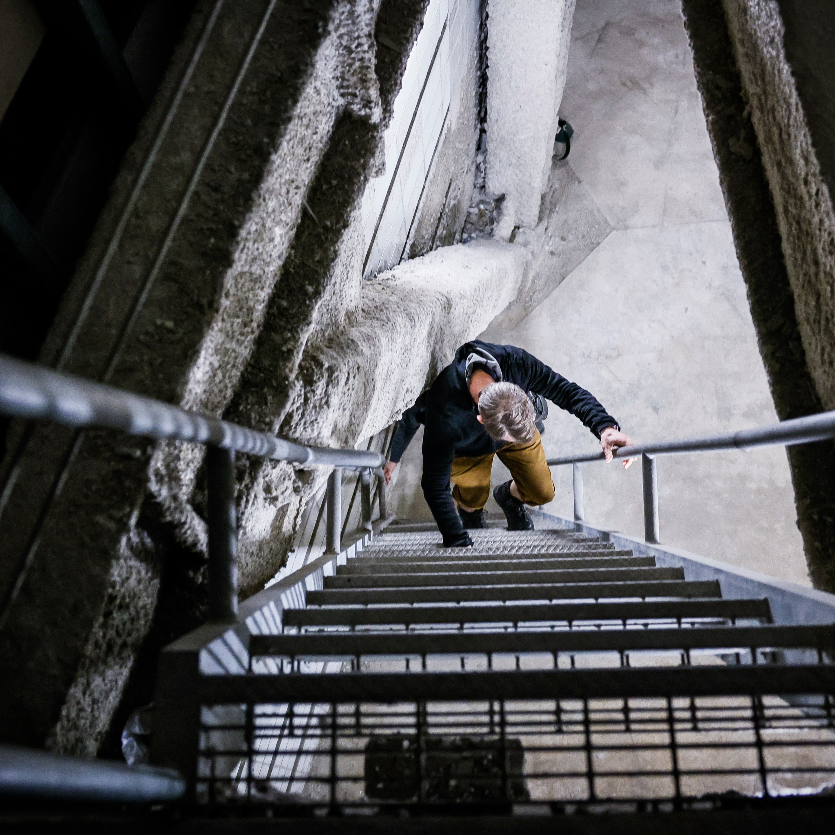 Michael Townsend descends the stairs from the space where the secret mall apartment used to be.