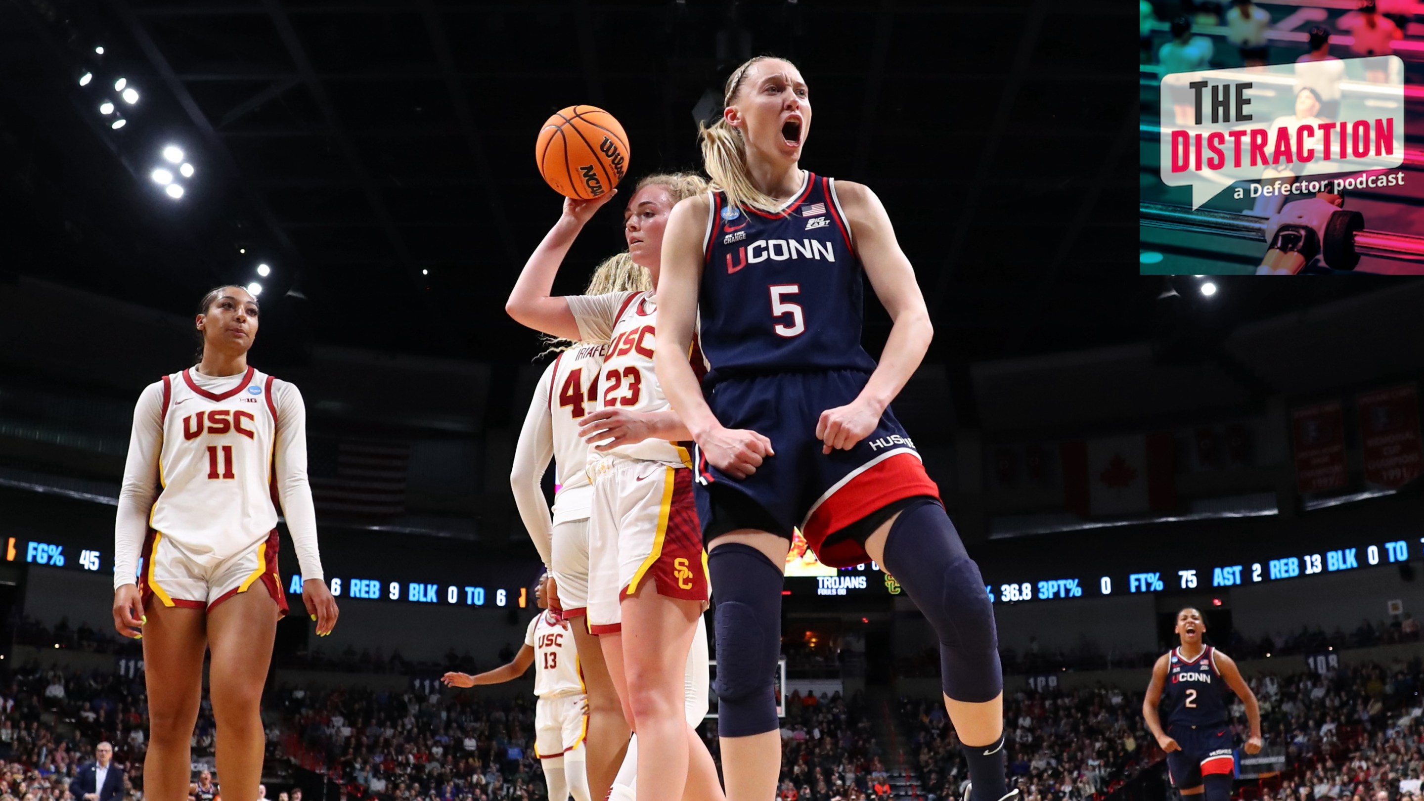 Paige Bueckers exults in a basket under the basket against the USC Trojans during the Elite Eight round of the 2025 NCAA Women's Basketball Tournament held at Spokane Arena on March 31, 2025.