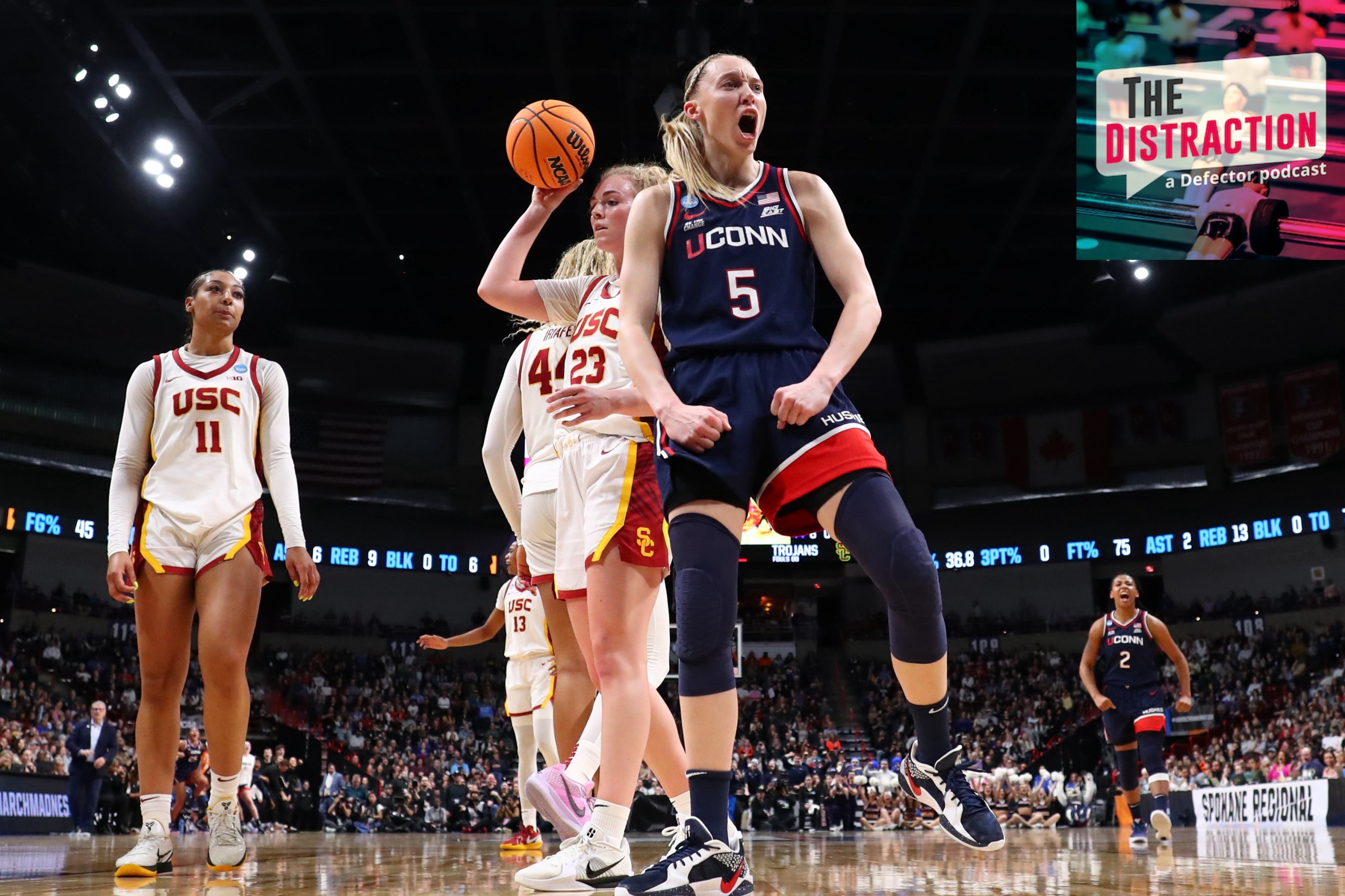 Paige Bueckers exults in a basket under the basket against the USC Trojans during the Elite Eight round of the 2025 NCAA Women's Basketball Tournament held at Spokane Arena on March 31, 2025.