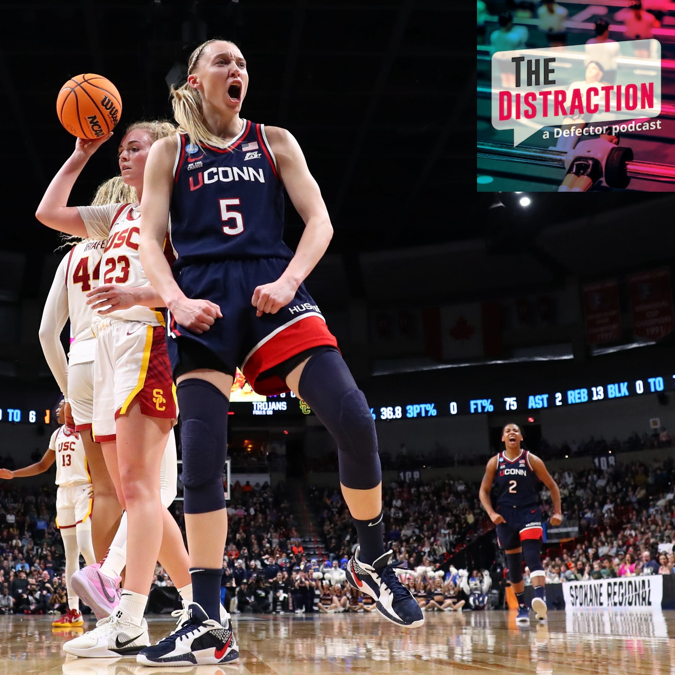 Paige Bueckers exults in a basket under the basket against the USC Trojans during the Elite Eight round of the 2025 NCAA Women's Basketball Tournament held at Spokane Arena on March 31, 2025.