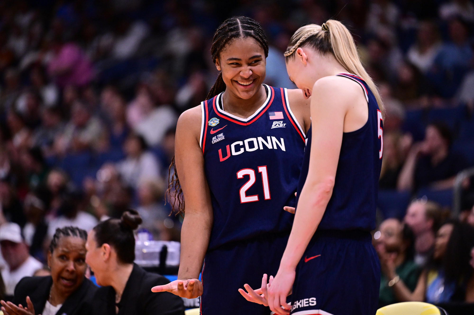 Sarah Strong #21 and Paige Bueckers #5 of the UConn Huskies react on the bench against the UCLA Bruins during the NCAA Women's Basketball Tournament Final Four semifinal game at Amalie Arena on April 4, 2025 in Tampa, Florida.