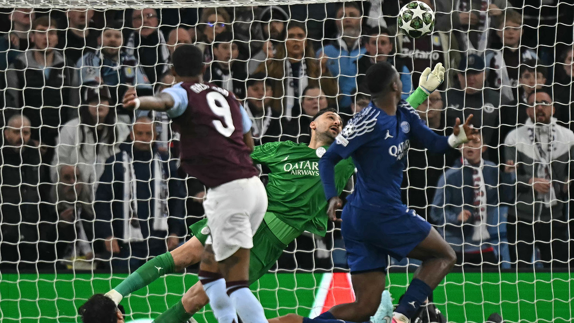 Italian goalkeeper #01 Gianluigi Donnarumma saves a shot from Aston Villa's English striker #09 Marcus Rashford during the UEFA Champions League quarter-final second-leg football match between Aston Villa and Paris Saint-Germain at Villa Park in Birmingham, central England on April 15, 2025.
