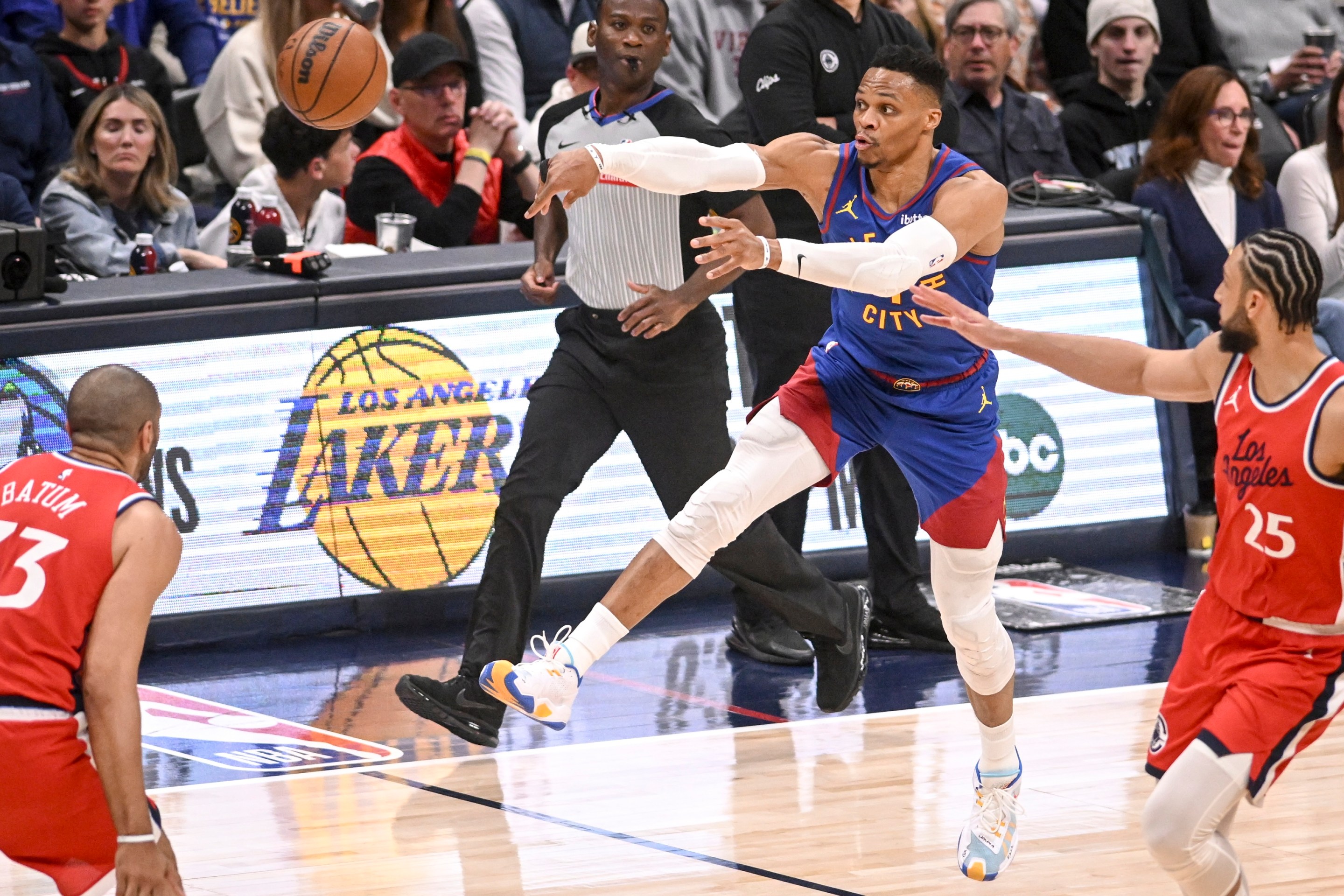DENVER, CO - APRIL 19: Russell Westbrook (4) of the Denver Nuggets pushes the ball in transition as Ben Simmons (25) of the LA Clippers defends during the third quarter of the Nuggets' 112-110 overtime win at Ball Arena in Denver, Colorado on Saturday, April 19, 2025. (Photo by AAron Ontiveroz/The Denver Post)