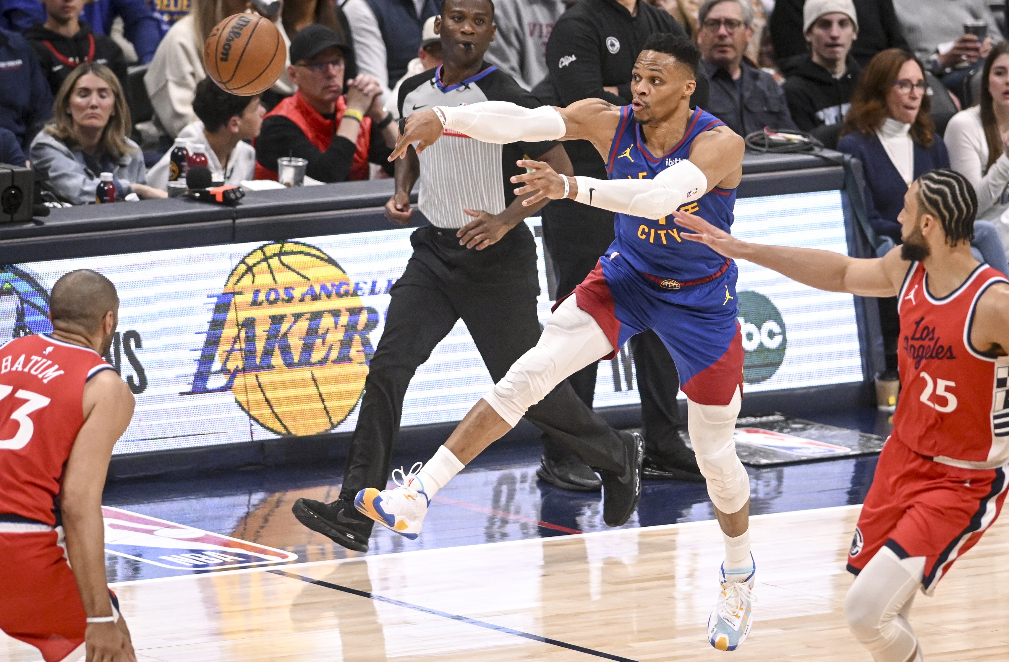 DENVER, CO - APRIL 19: Russell Westbrook (4) of the Denver Nuggets pushes the ball in transition as Ben Simmons (25) of the LA Clippers defends during the third quarter of the Nuggets' 112-110 overtime win at Ball Arena in Denver, Colorado on Saturday, April 19, 2025. (Photo by AAron Ontiveroz/The Denver Post)