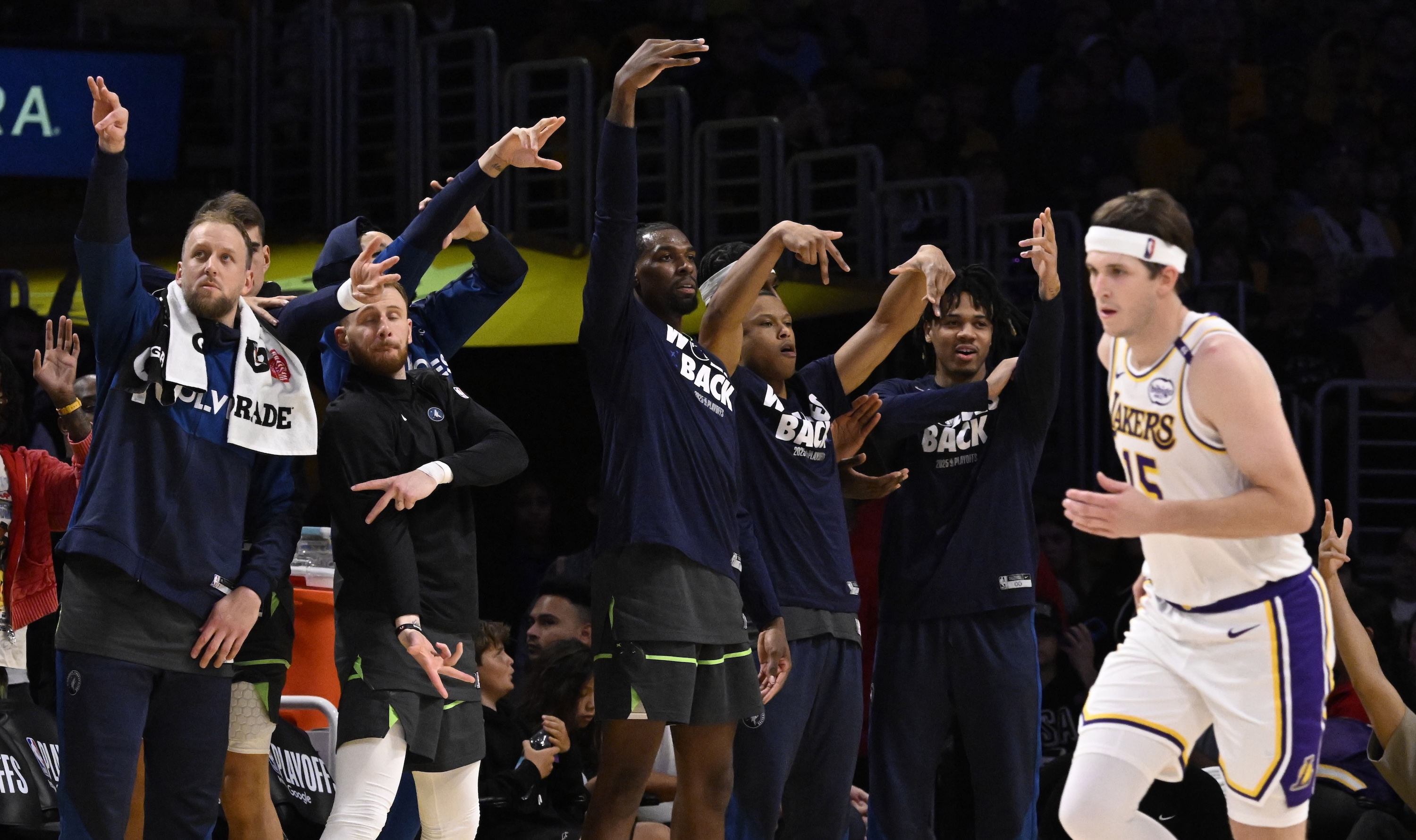 Los Angeles, CA - April 19: Minnesota Timberwolves bench reacts after a basket as Austin Reaves #15 of the Los Angeles Lakers looks on in the second half of a first round game one NBA basketball game at Crypto.com Arena in Los Angeles on Saturday, April 19, 2025. (Photo by Keith Birmingham/MediaNews Group/Pasadena Star-News via Getty Images)