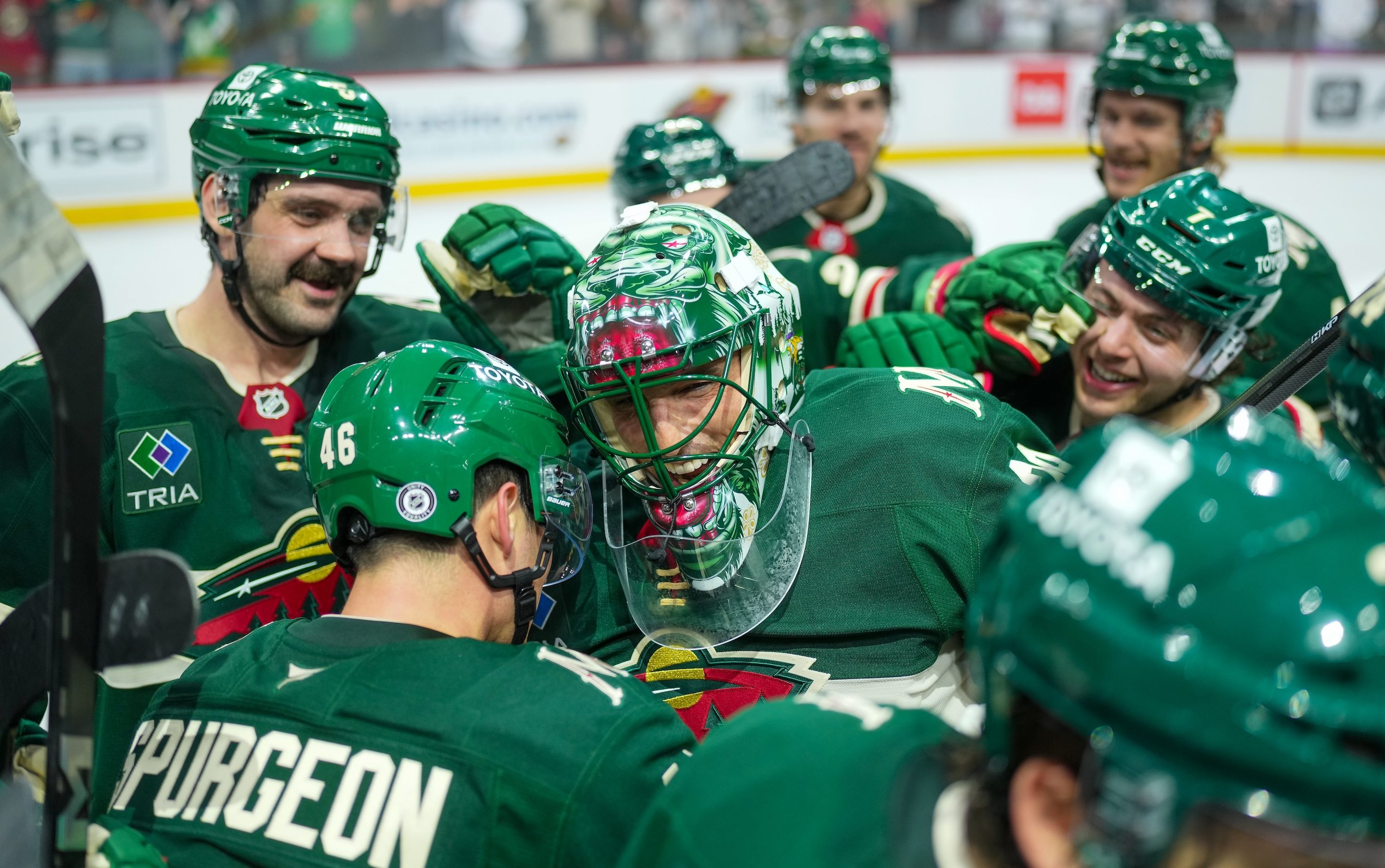 ST PAUL, MINNESOTA - APRIL 15:-Andre Fleury #29 of the Minnesota Wild gets surrounded by teammates after an overtime win against the Anaheim Ducks at Xcel Energy Center on April 15, 2025 in St Paul, Minnesota. (Photo by Luke Schmidt/NHLI via Getty Images)
