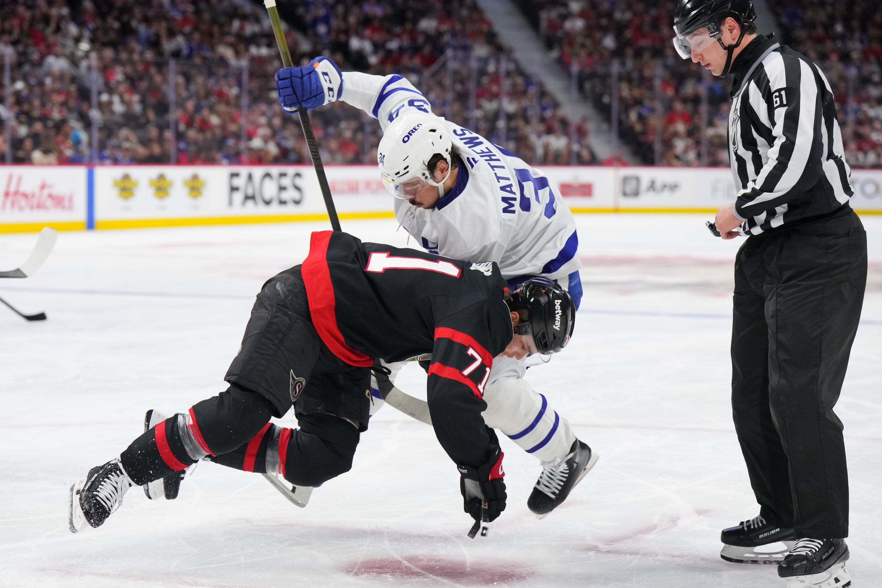 OTTAWA, CANADA - APRIL 24: Ridly Greig #71 of the Ottawa Senators battles for puck possession during a faceoff against Auston Matthews #34 of the Toronto Maple Leafs in the second period of Game Three of the First Round of the 2025 Stanley Cup Playoffs at Canadian Tire Centre on April 24, 2025 in Ottawa, Ontario, Canada. (Photo by André Ringuette/NHLI via Getty Images)