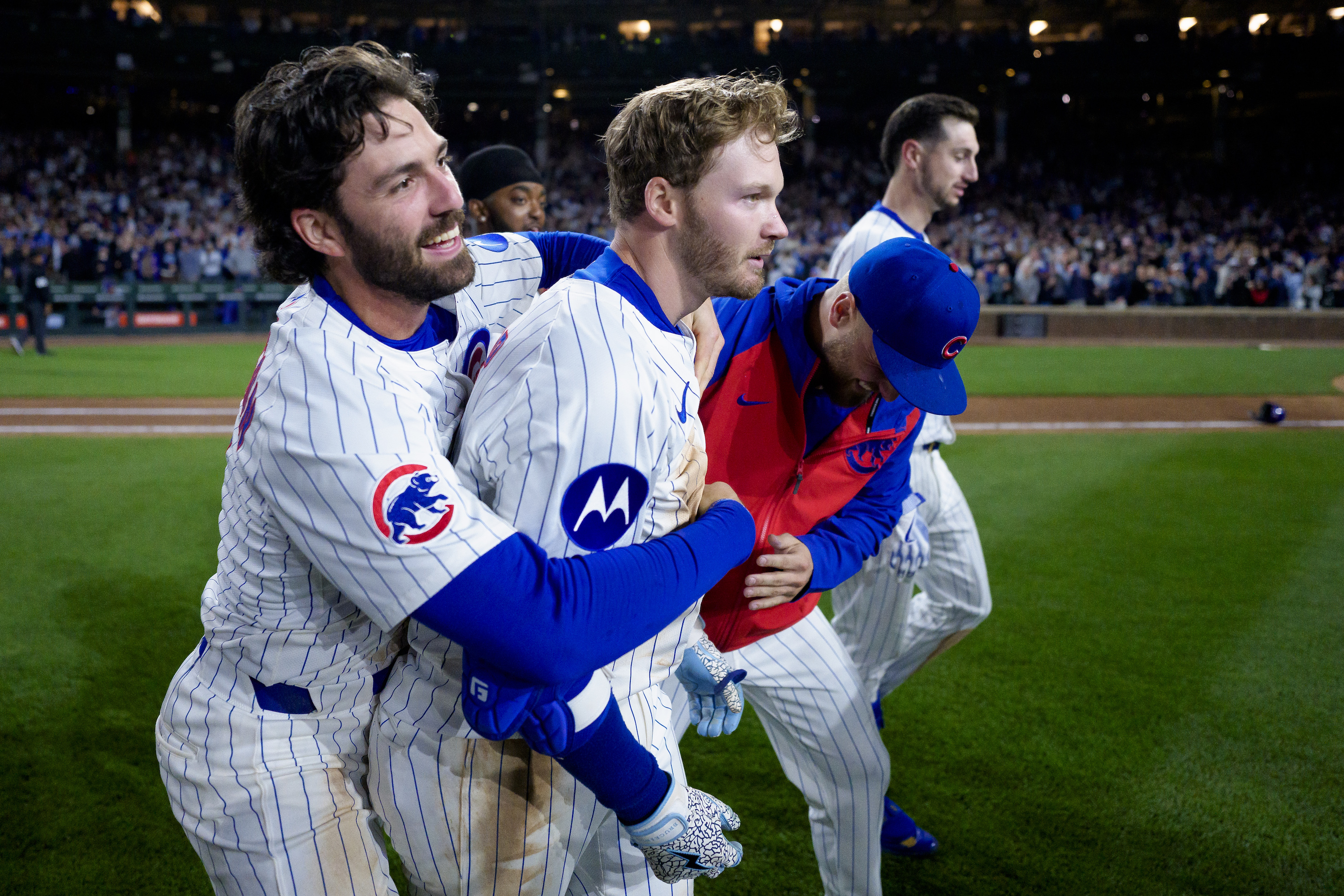 Ian Happ #8 of the Chicago Cubs celebrates a walk-off hit in the bottom of the tenth inning of a game against the Los Angeles Dodgers at Wrigley Field on April 22, 2025 in Chicago, Illinois.