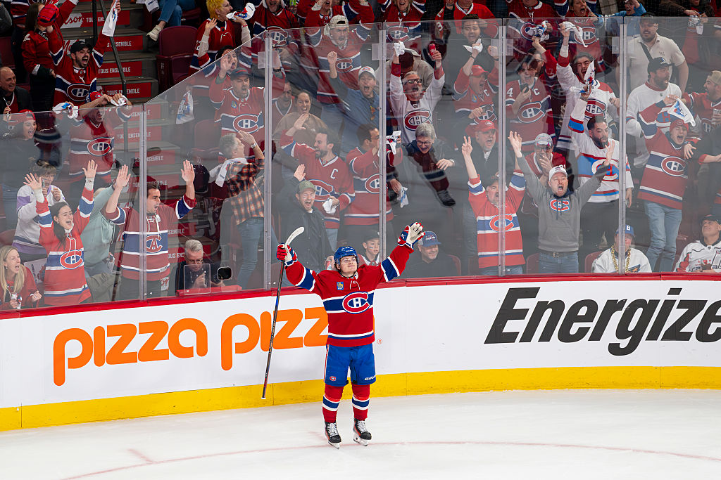 Cole Caufield #13 of the Montreal Canadiens celebrates after scoring a goal