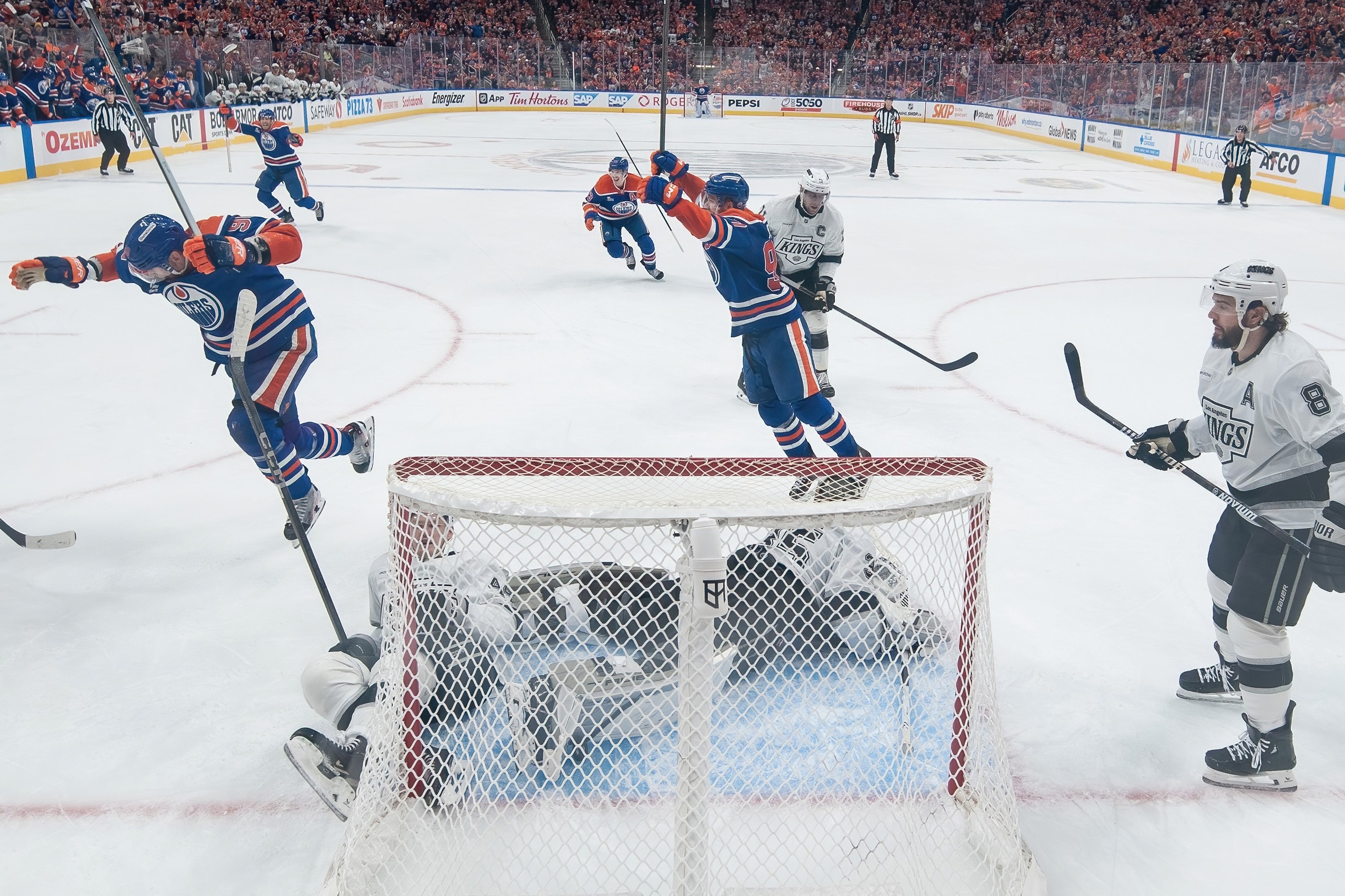 EDMONTON, CANADA - APRIL 27: Corey Perry #90 and Connor McDavid #97 of the Edmonton Oilers celebrate an overtime goal by Leon Draisaitl #29 to win the game against the Los Angeles Kings during Game Four of the First Round of the Stanley Cup Playoffs at Rogers Place on April 27, 2025, in Edmonton, Alberta, Canada. (Photo by Andy Devlin/NHLI via Getty Images)
