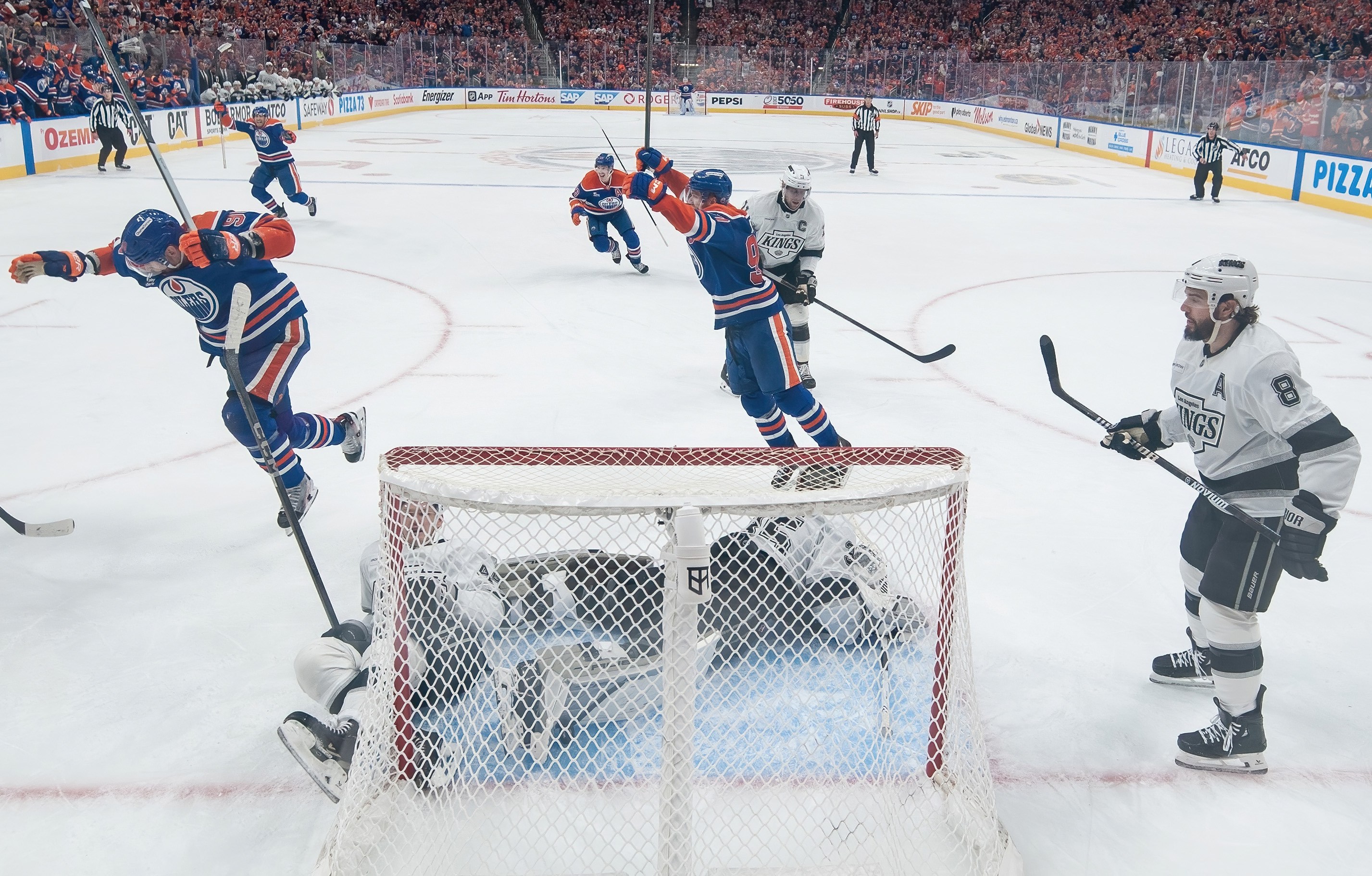 EDMONTON, CANADA - APRIL 27: Corey Perry #90 and Connor McDavid #97 of the Edmonton Oilers celebrate an overtime goal by Leon Draisaitl #29 to win the game against the Los Angeles Kings during Game Four of the First Round of the Stanley Cup Playoffs at Rogers Place on April 27, 2025, in Edmonton, Alberta, Canada. (Photo by Andy Devlin/NHLI via Getty Images)