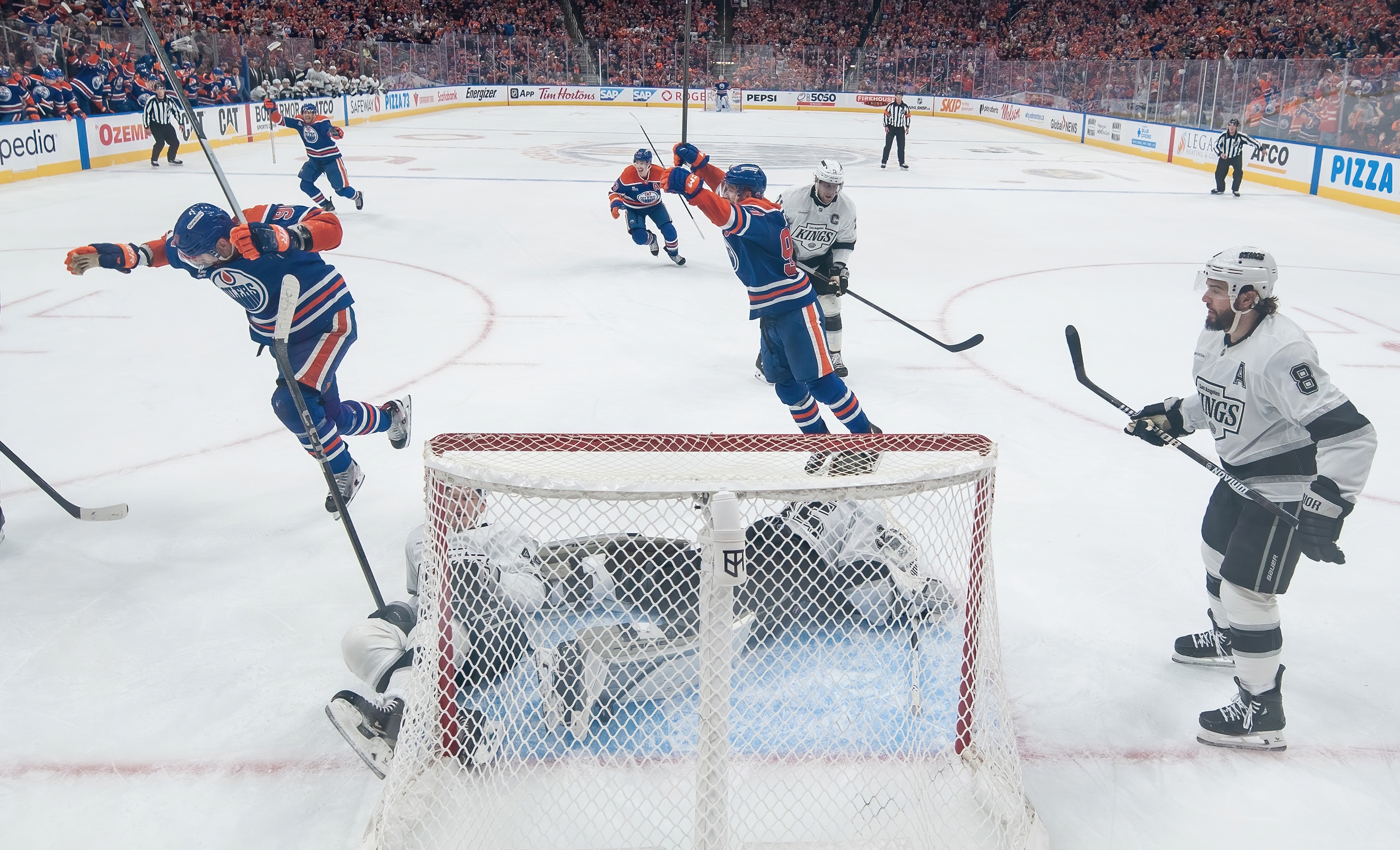 EDMONTON, CANADA - APRIL 27: Corey Perry #90 and Connor McDavid #97 of the Edmonton Oilers celebrate an overtime goal by Leon Draisaitl #29 to win the game against the Los Angeles Kings during Game Four of the First Round of the Stanley Cup Playoffs at Rogers Place on April 27, 2025, in Edmonton, Alberta, Canada. (Photo by Andy Devlin/NHLI via Getty Images)