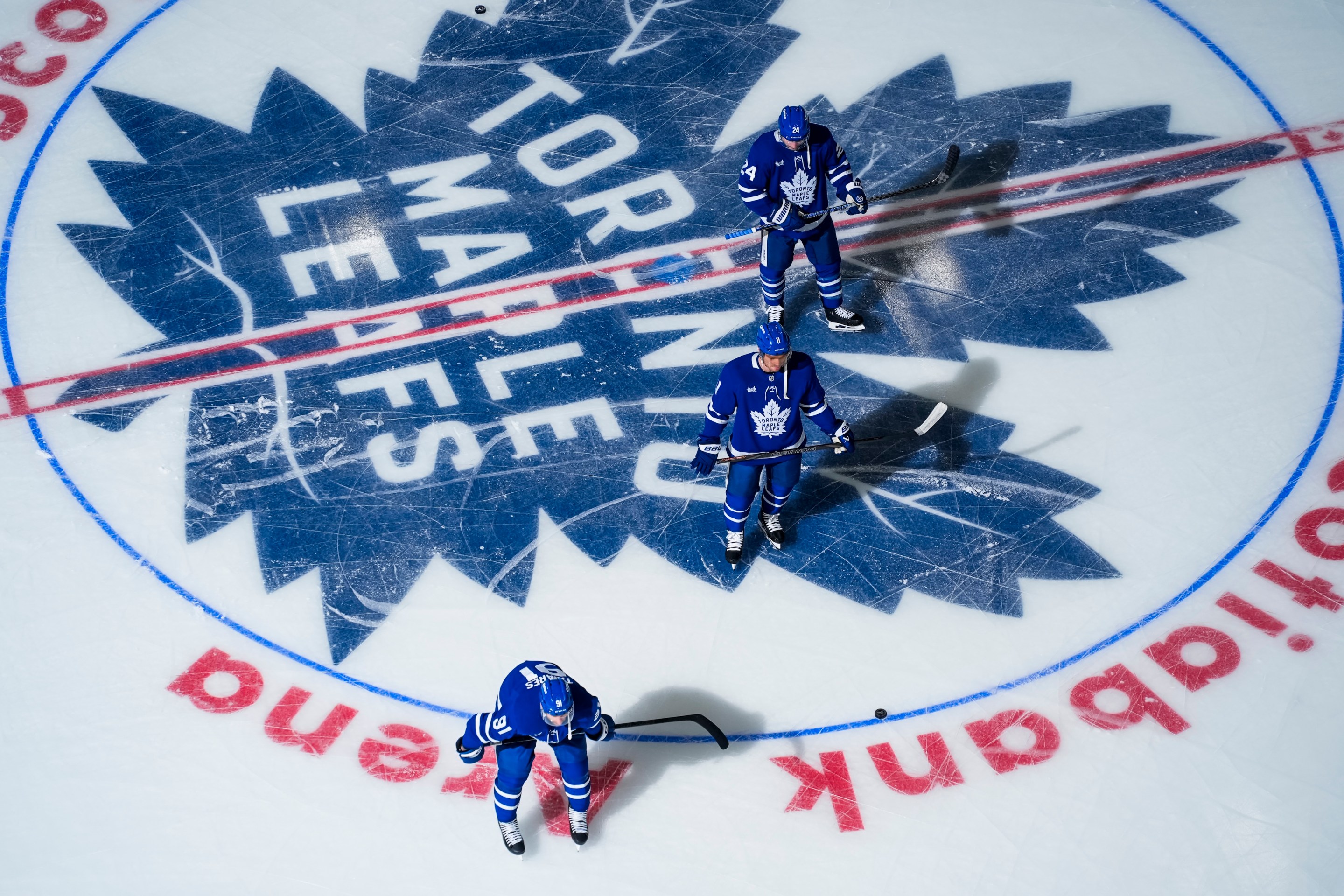 TORONTO, ON - APRIL 29: John Tavares #91, Max Domi #11 and Scott Laughton #24 of the Toronto Maple Leafs warm-up before Game Five of the First Round of the 2025 Stanley Cup Playoffs against the Ottawa Senators at the Scotiabank Arena on April 29, 2025 in Toronto, Ontario, Canada. (Photo by Mark Blinch/NHLI via Getty Images)