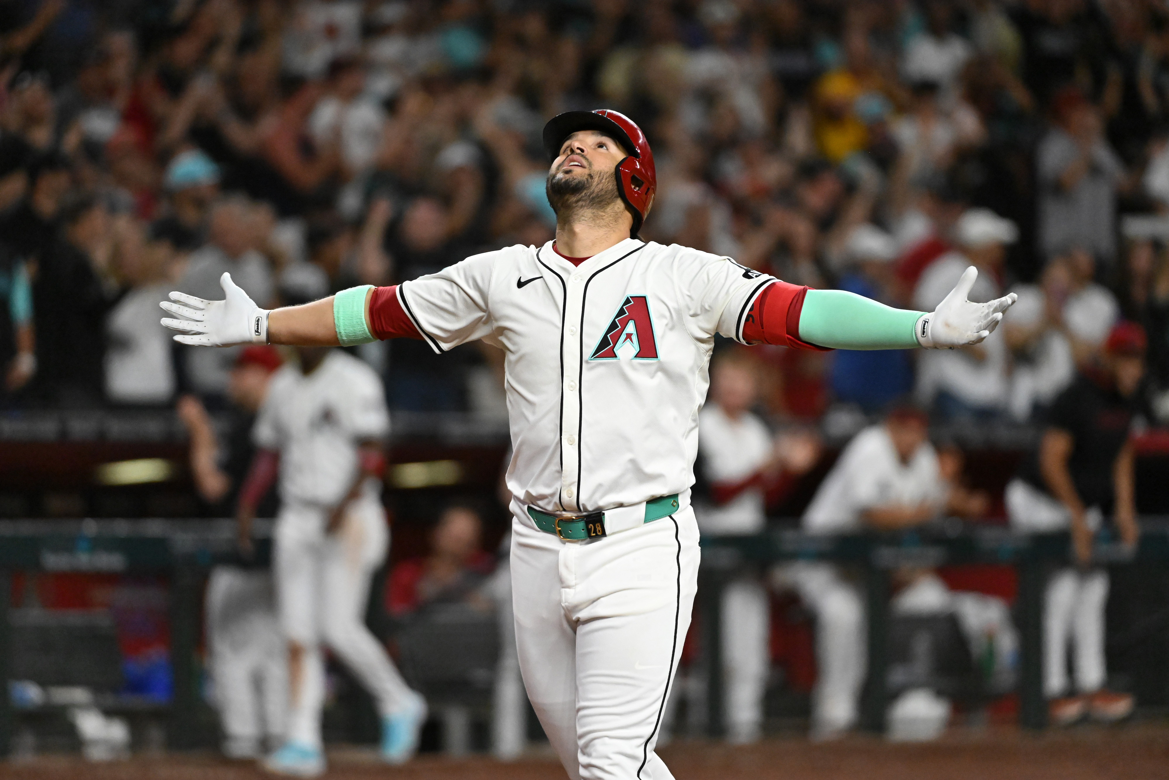 Eugenio Suarez celebrates after hitting his fourth homer of Saturday's game against the Braves.