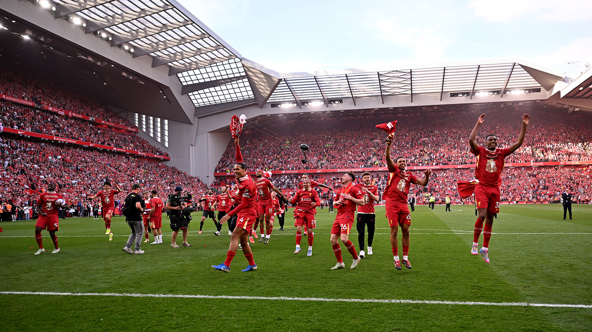 Andy Robertson, Trent Alexander-Arnold Ibrahima Konate and Virgil van Dijk captain of Liverpool celebrating after being named Champions of the Premier League at the end of the Premier League match between Liverpool FC and Tottenham Hotspur FC at Anfield on April 27, 2025 in Liverpool, England.