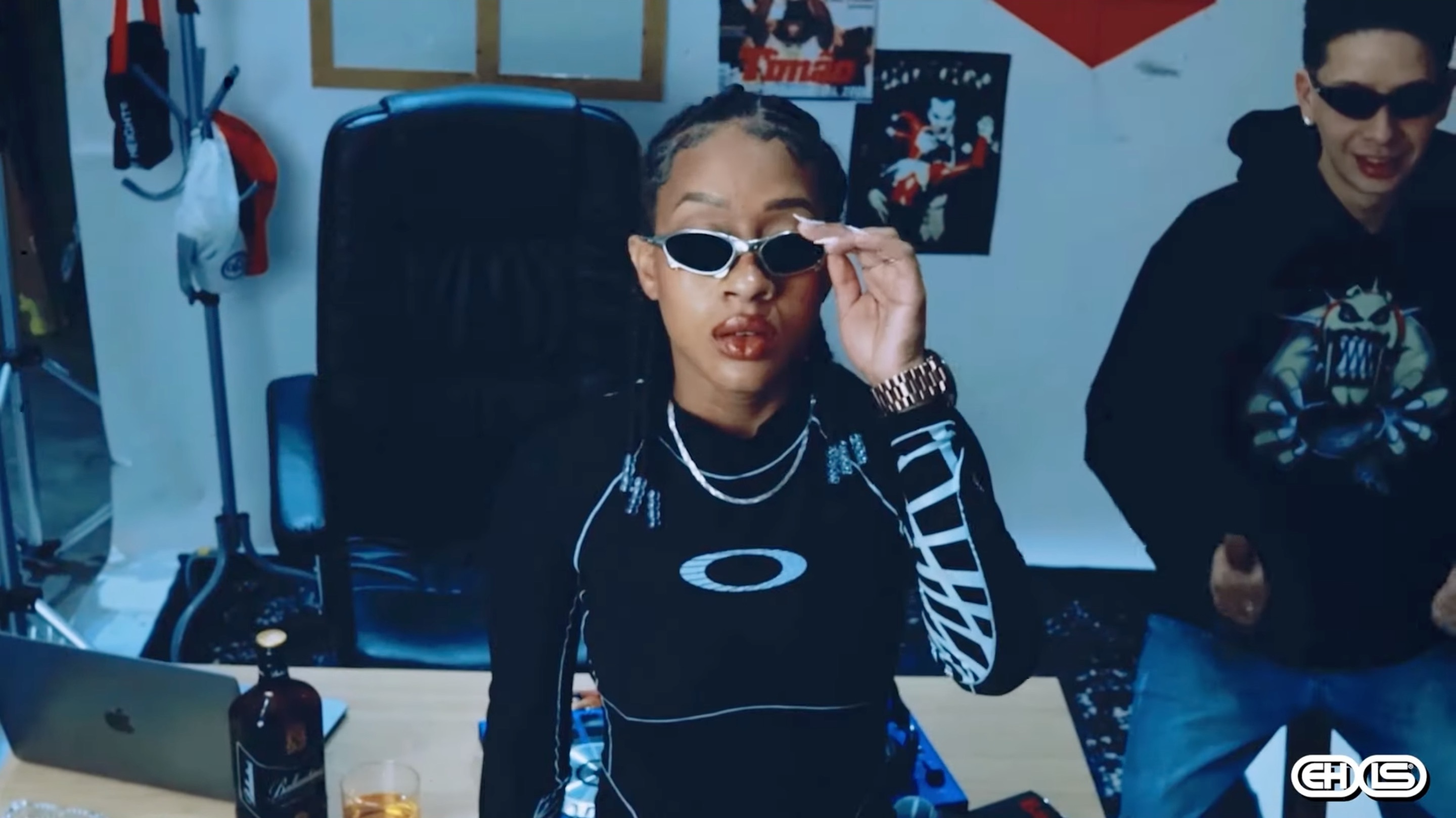 Still image of MC Ktrine and DJ Saze from the music video for "Bonde da Ó."
