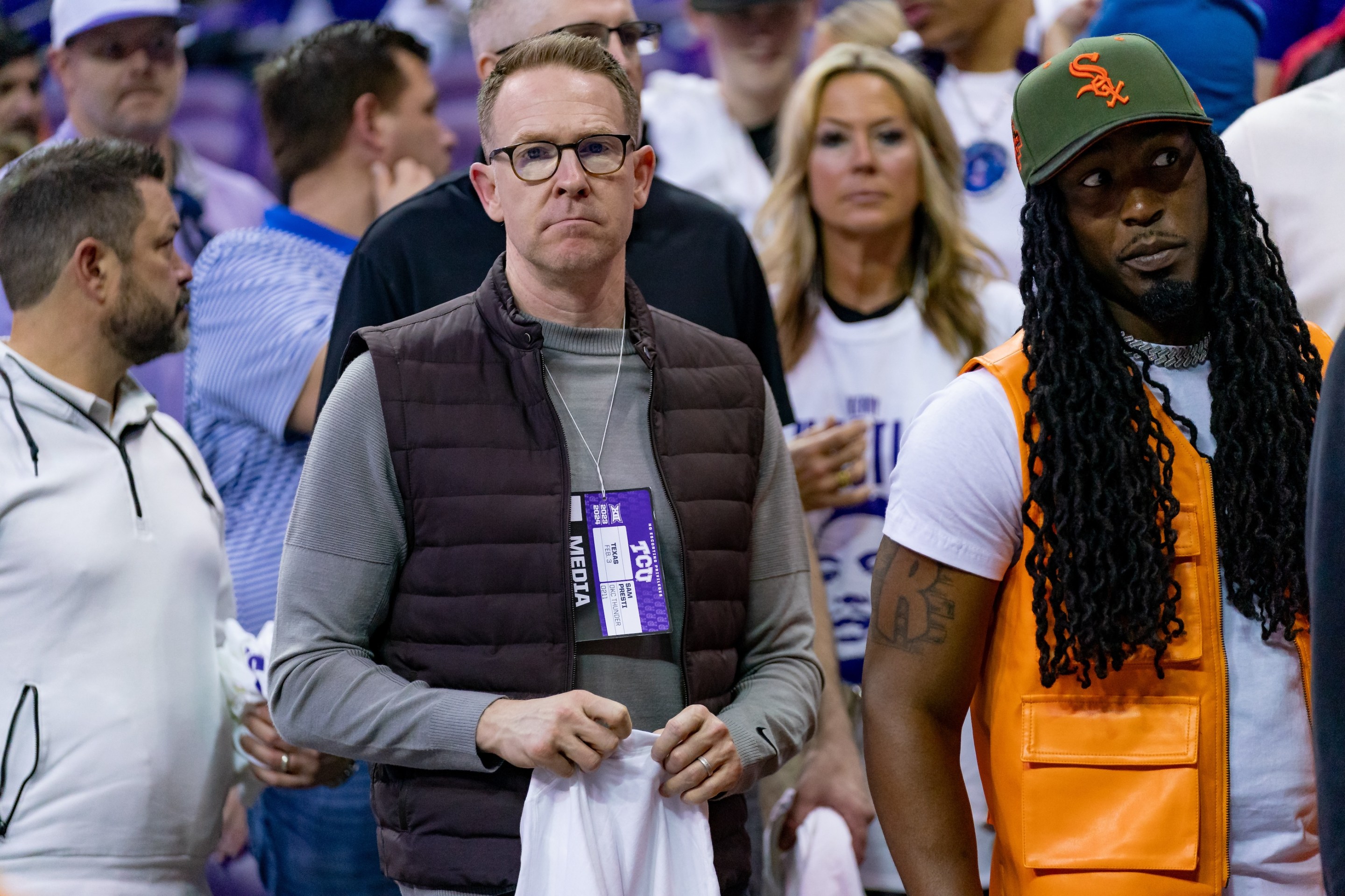 Oklahoma City Thunder General Manager Sam Presti, at center in glasses and a vest, was in attendance for the retirement of Kendrick Williams during a college basketball game between Texas Longhorns and the TCU Horned Frogs on February 3, 2024.