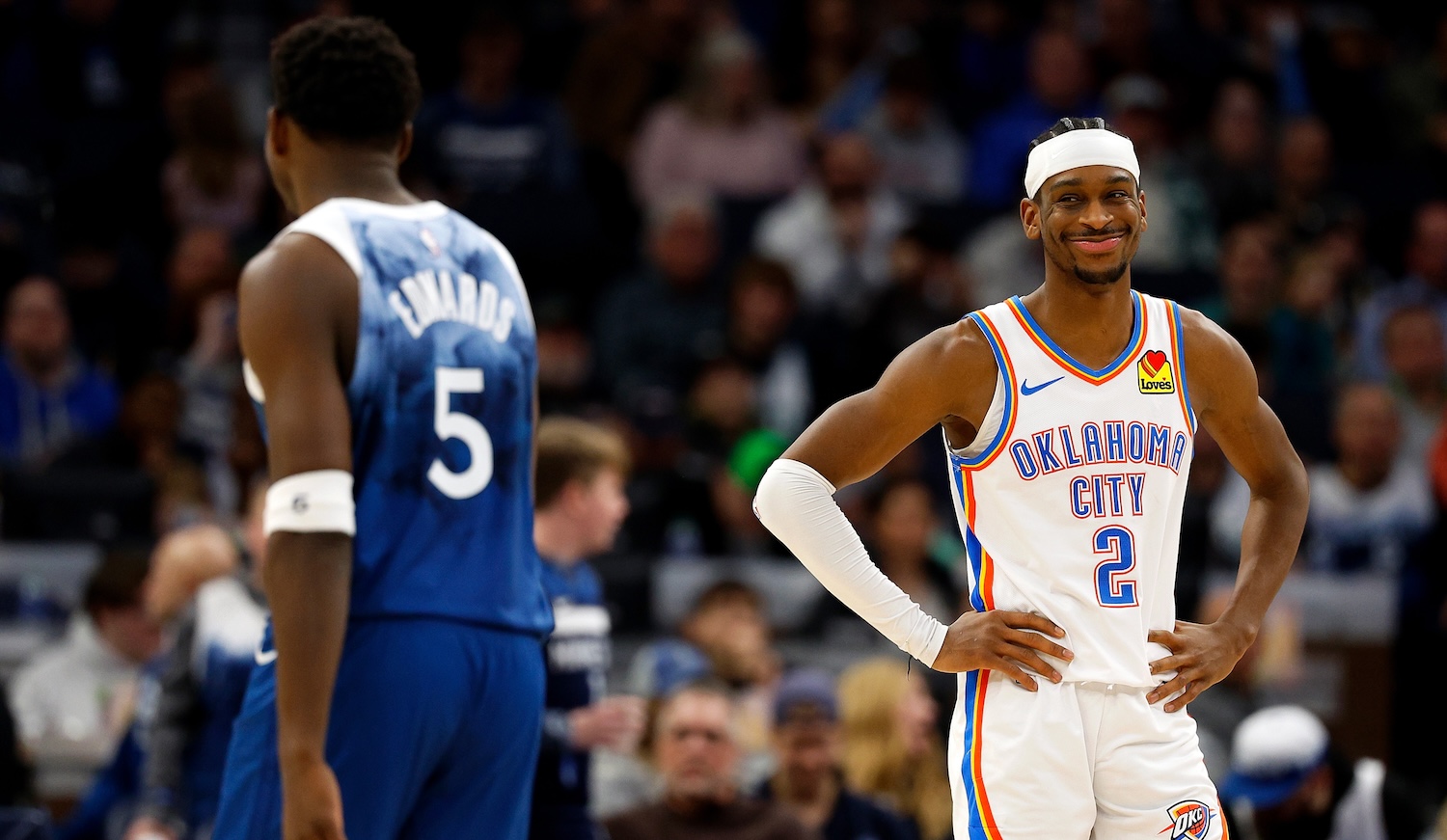 MINNEAPOLIS, MINNESOTA - JANUARY 20: Shai Gilgeous-Alexander #2 of the Oklahoma City Thunder reacts to Anthony Edwards #5 of the Minnesota Timberwolves in the third quarter at Target Center on January 20, 2024 in Minneapolis, Minnesota. The Thunder defeated the Timberwolves 102-97. NOTE TO USER: User expressly acknowledges and agrees that, by downloading and or using this photograph, User is consenting to the terms and conditions of the Getty Images License Agreement. (Photo by David Berding/Getty Images)