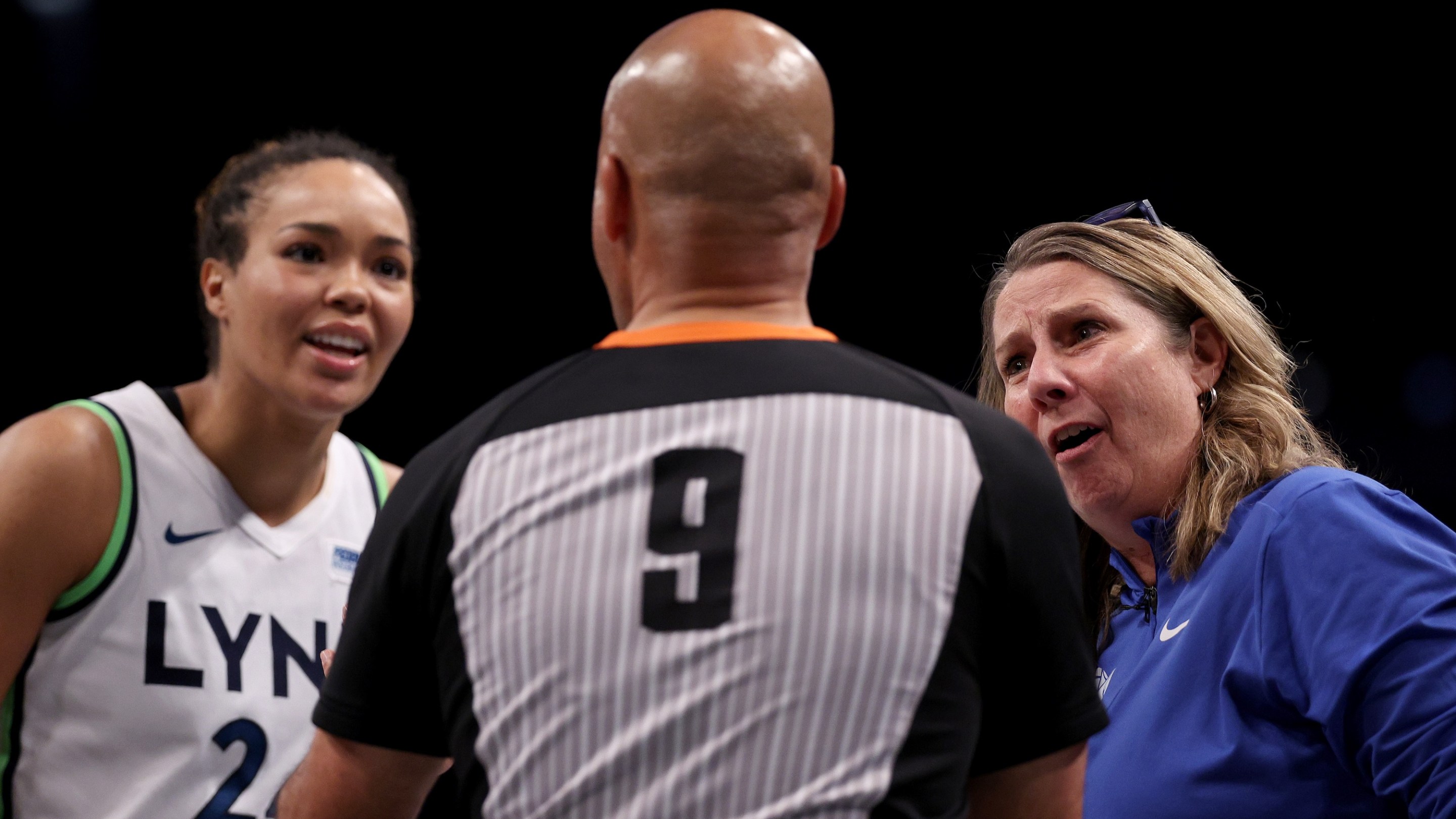 Minnesota Lynx head coach Cheryl Reeve and Napheesa Collier #24 talk with referee Tim Greene after a foul call in the fourth quarter against the New York Liberty during Game Five of the WNBA Finals at Barclays Center on October 20, 2024 in the Brooklyn borough of New York City. The New York Liberty defeated the Minnesota Lynx 67-62 in overtime to win the championship.