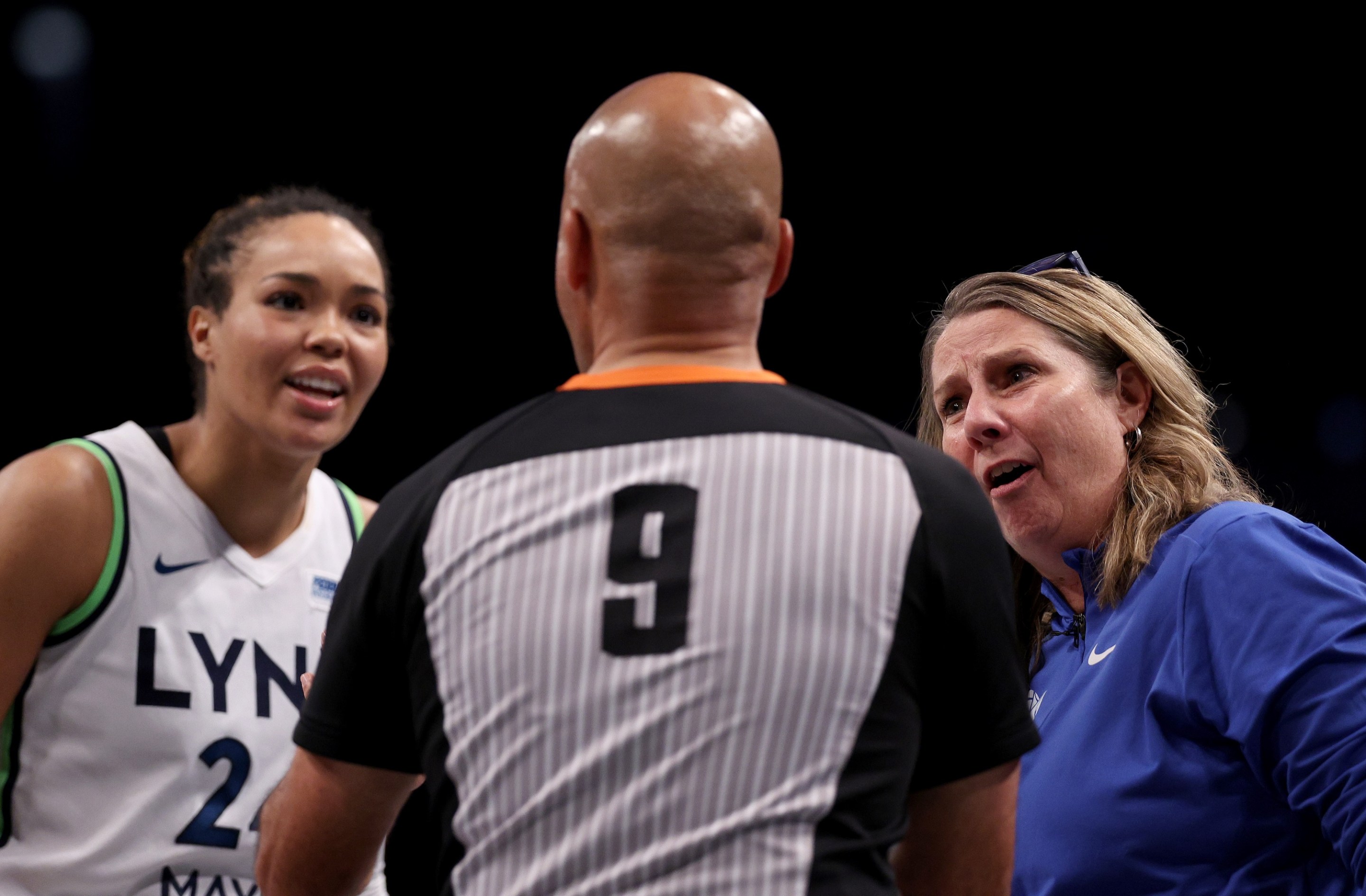 Minnesota Lynx head coach Cheryl Reeve and Napheesa Collier #24 talk with referee Tim Greene after a foul call in the fourth quarter against the New York Liberty during Game Five of the WNBA Finals at Barclays Center on October 20, 2024 in the Brooklyn borough of New York City. The New York Liberty defeated the Minnesota Lynx 67-62 in overtime to win the championship.