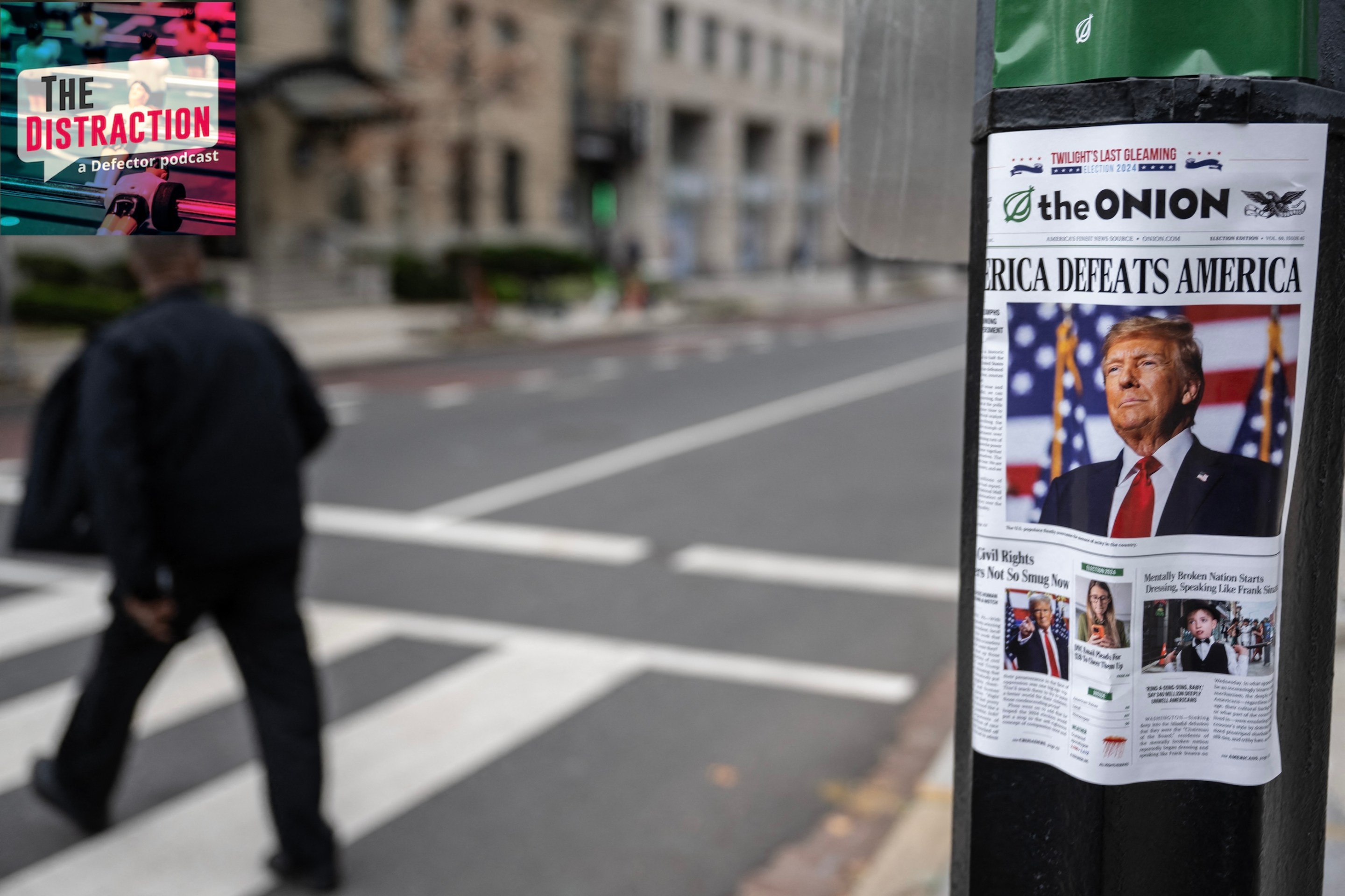 A copy of "The Onion," a satirical newspaper, is seen on a lamppost in downtown Washington, DC on November 14, 2024. The lead headline reads "America Defeats America."