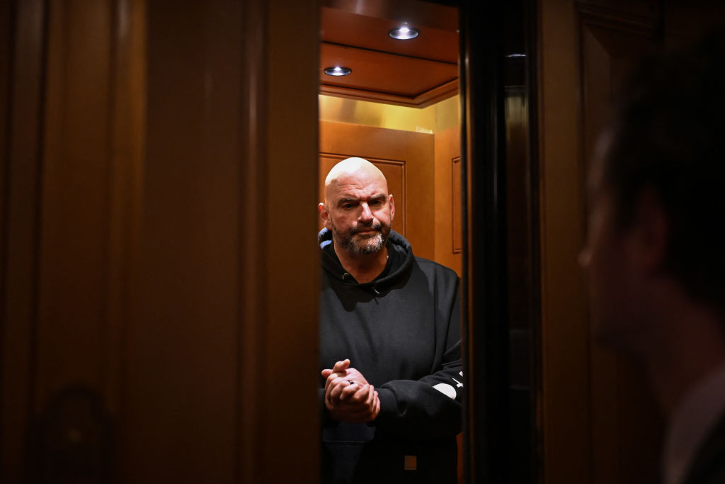 John Fetterman pouts inside an elevator