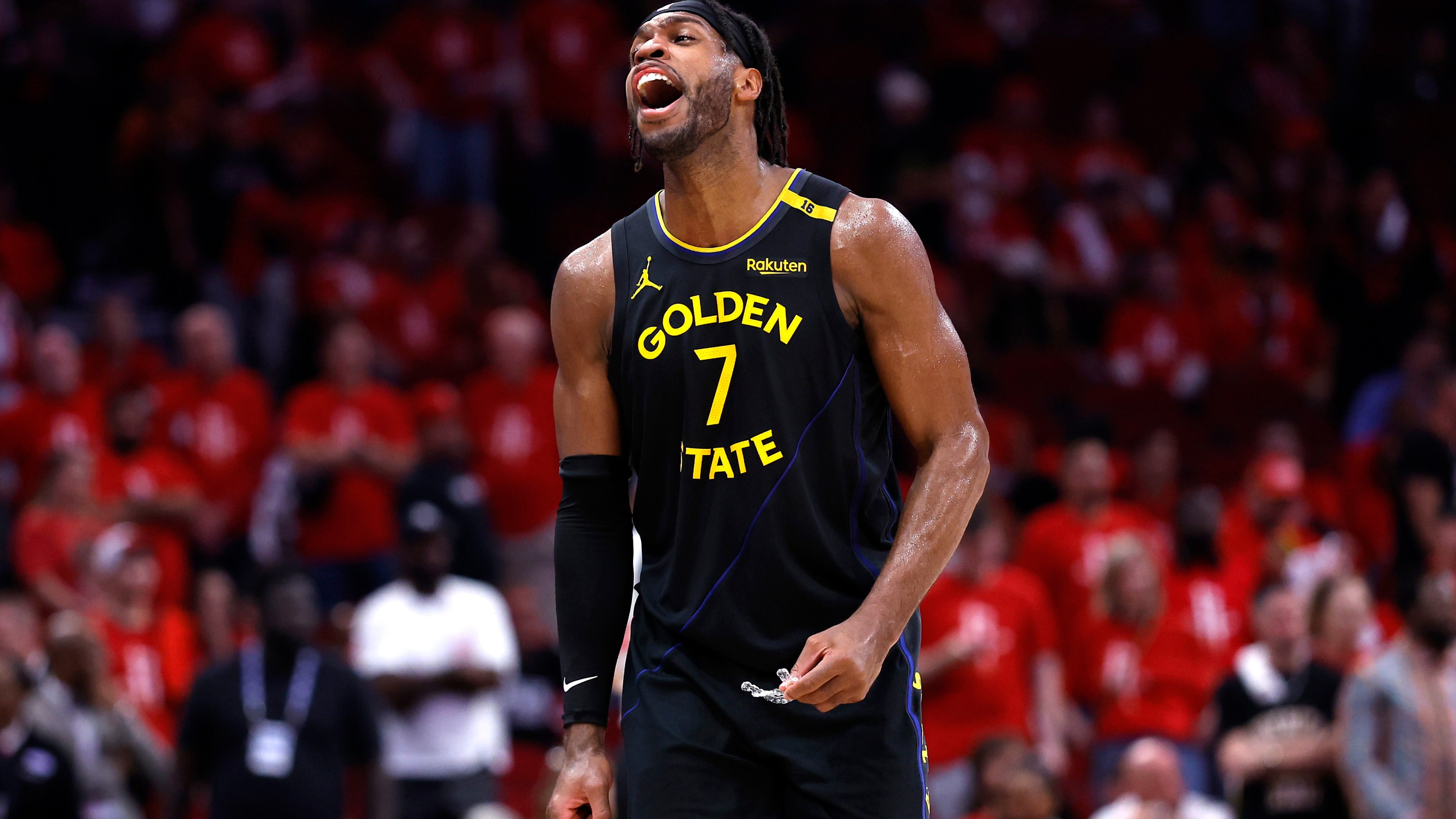 Buddy Hield of the Golden State Warriors reacts against the Houston Rockets after making a three-point basket during the fourth quarter in Game Seven of the Western Conference First Round NBA Playoffs.