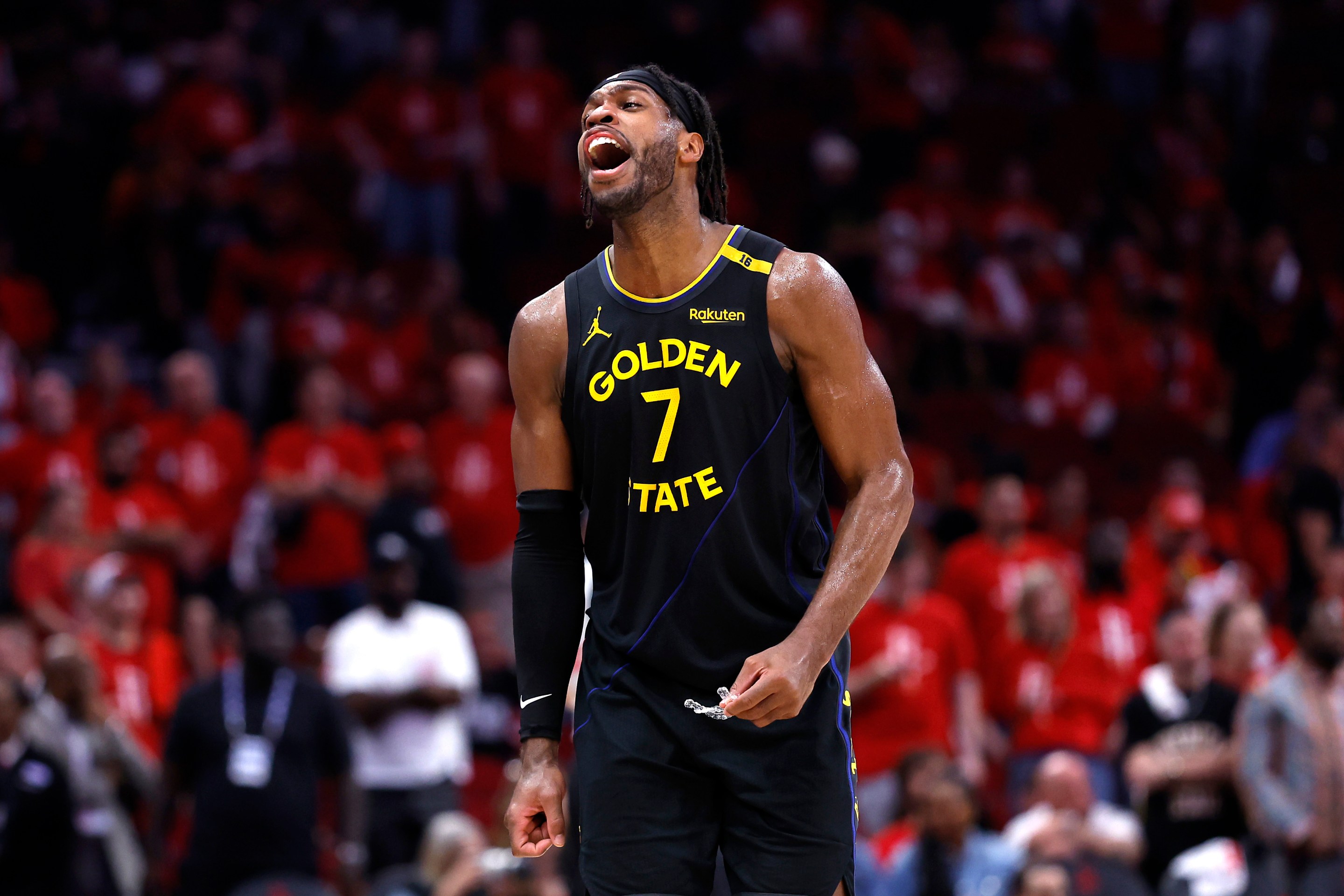 Buddy Hield of the Golden State Warriors reacts against the Houston Rockets after making a three-point basket during the fourth quarter in Game Seven of the Western Conference First Round NBA Playoffs.