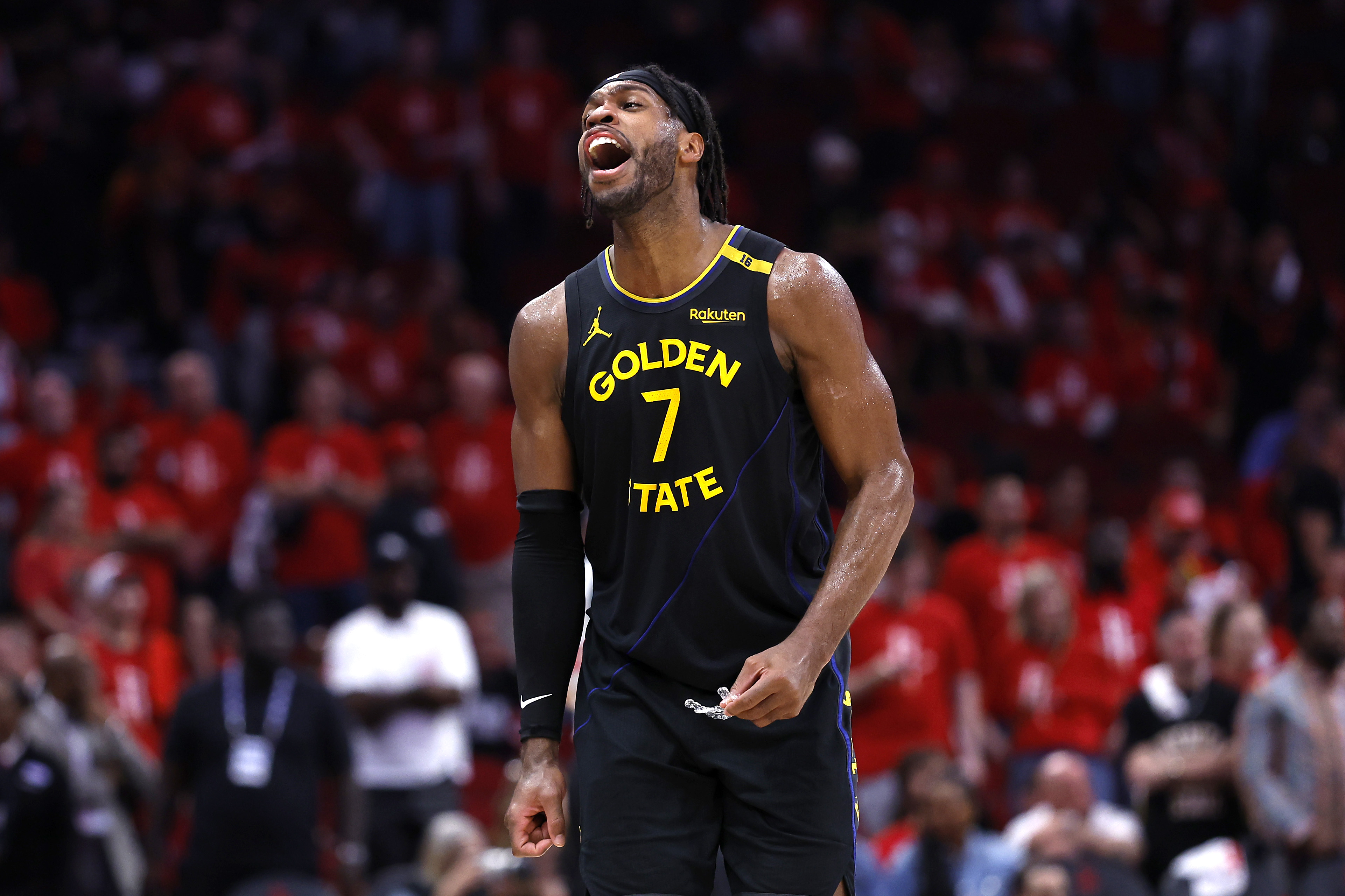 Buddy Hield of the Golden State Warriors reacts against the Houston Rockets after making a three-point basket during the fourth quarter in Game Seven of the Western Conference First Round NBA Playoffs.