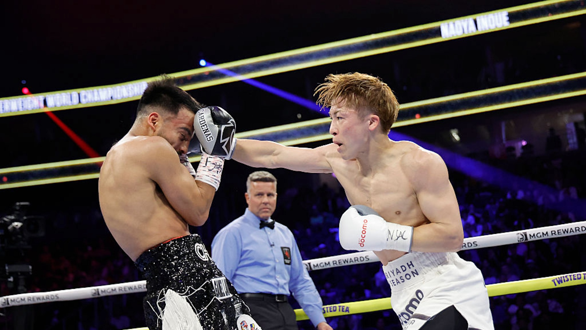 Undisputed junior featherweight champion Naoya Inoue (R) punches Ramon Cardenas in the fourth round of their title fight at T-Mobile Arena on May 04, 2025 in Las Vegas, Nevada. Inoue retained his titles with an eighth-round TKO.