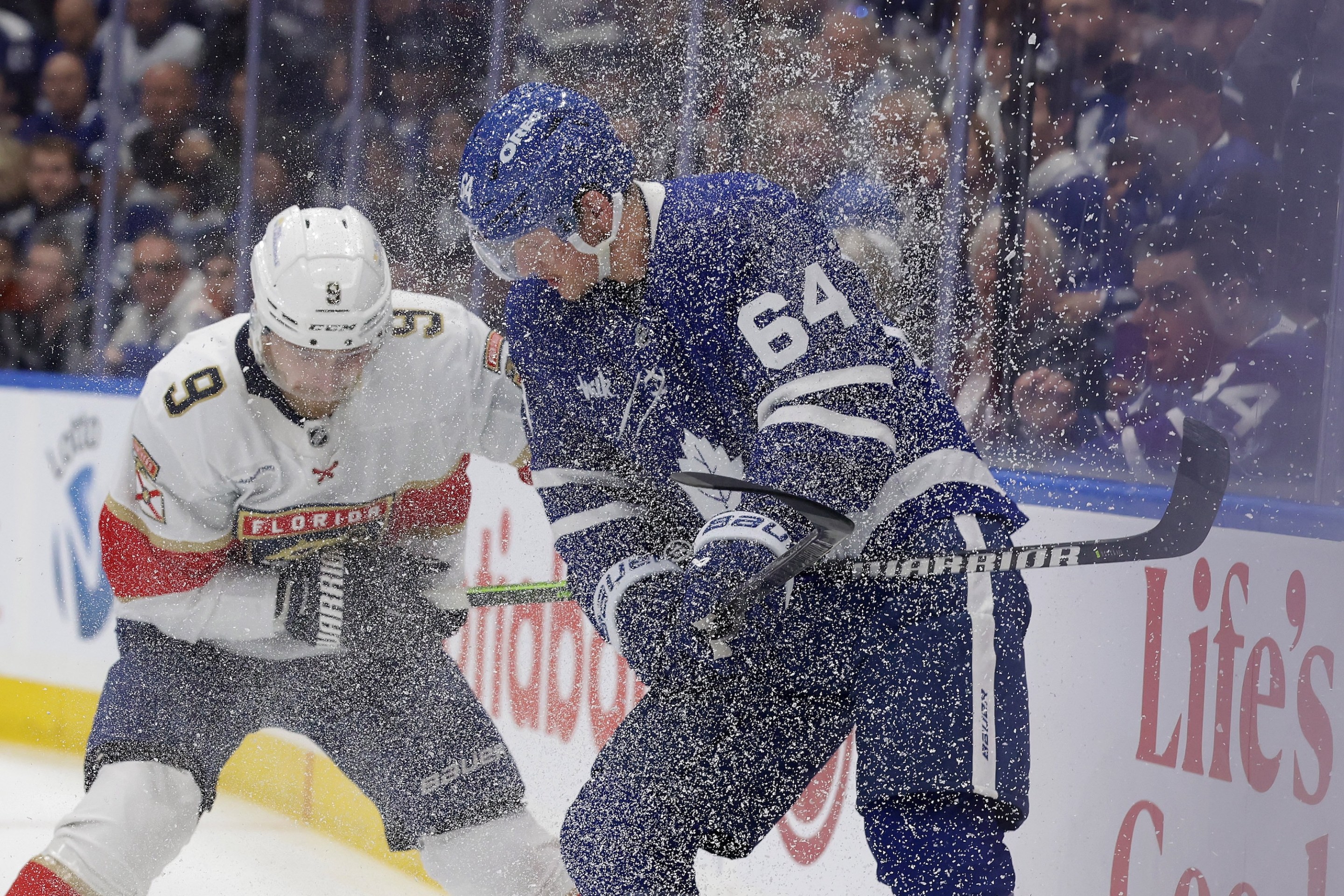 TORONTO, ON- MAY 14 - Florida Panthers center Sam Bennett (9) and Toronto Maple Leafs center David Kampf (64) battle in the snow in first period action as the Toronto Maple Leafs play the Florida Panthers in game five in the second round of the NHL Stanley Cup play-offs at Scotiabank Arena in Toronto. May 14, 2025. Steve Russell/Toronto Star