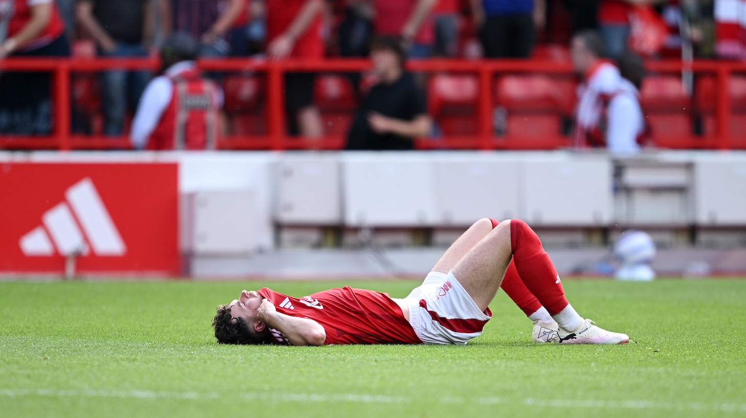 Neco Williams of Nottingham Forest looks dejected after the draw in the Premier League match between Nottingham Forest FC and Leicester City FC at City Ground on May 11, 2025 in Nottingham, England.