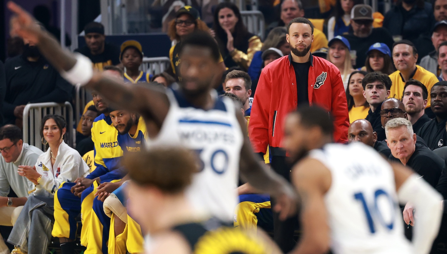 SAN FRANCISCO, CALIFORNIA - MAY 12: Stephen Curry #30 of the Golden State Warriors looks on from the bench during the first quarter against the Minnesota Timberwolves in Game Four of the Western Conference Second Round NBA Playoffs at Chase Center on May 12, 2025 in San Francisco, California. NOTE TO USER: User expressly acknowledges and agrees that, by downloading and or using this photograph, User is consenting to the terms and conditions of the Getty Images License Agreement. (Photo by Ezra Shaw/Getty Images)