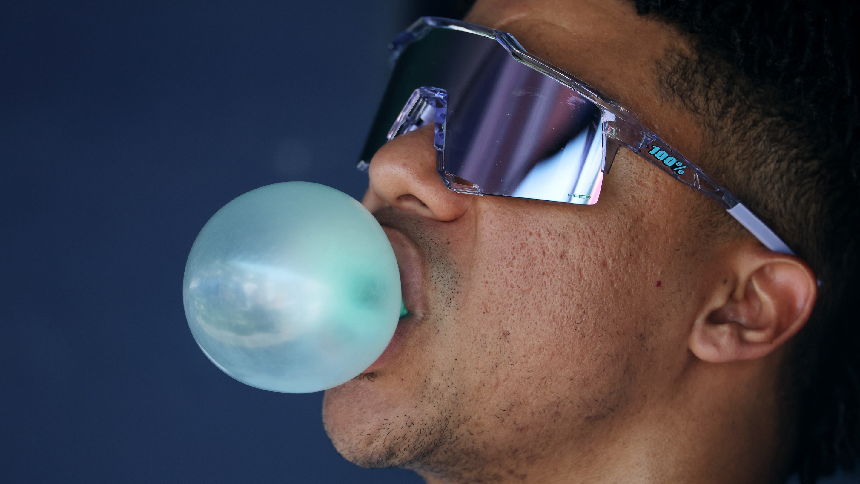 Juan Soto of the New York Mets blows a bubble in the dugout during the game against the New York Mets during their game at Yankee Stadium on May 17, 2025.