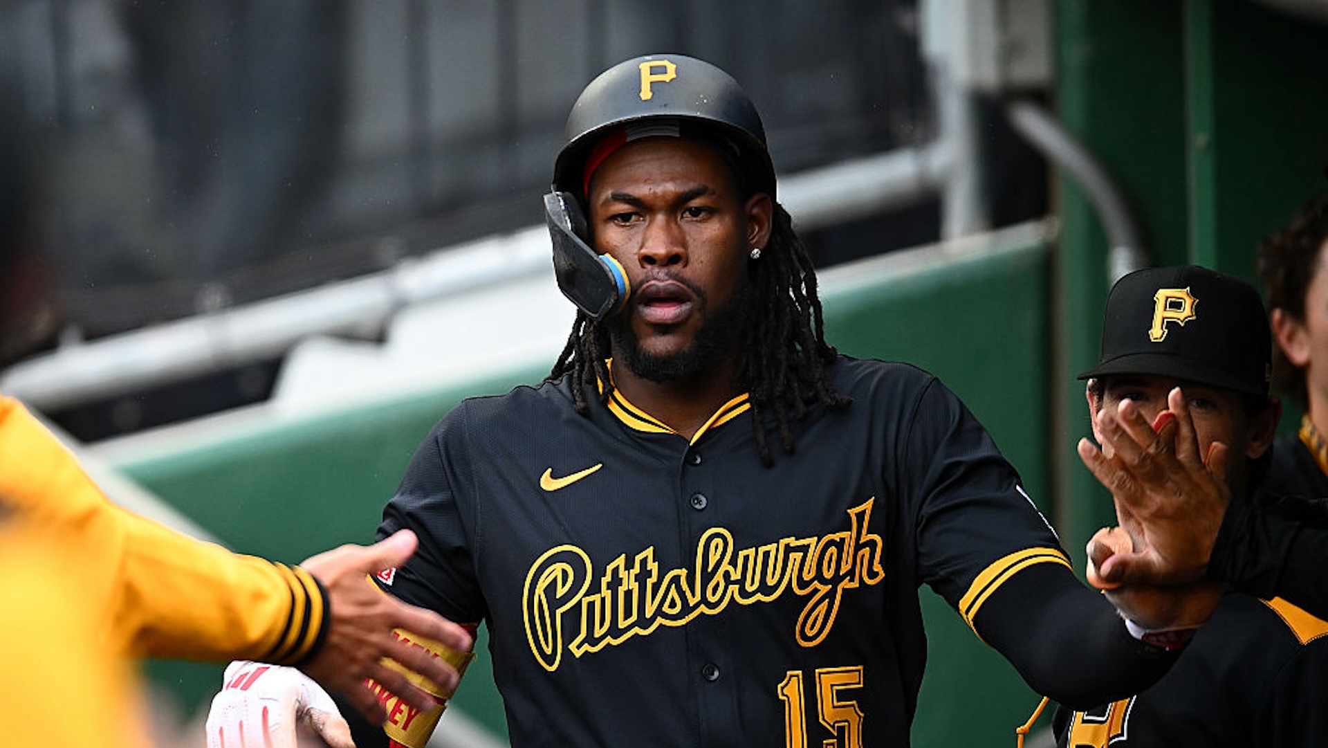 Oneil Cruz #15 of the Pittsburgh Pirates celebrates with teammates after scoring during the first inning against the Milwaukee Brewers at PNC Park on May 22, 2025 in Pittsburgh, Pennsylvania.
