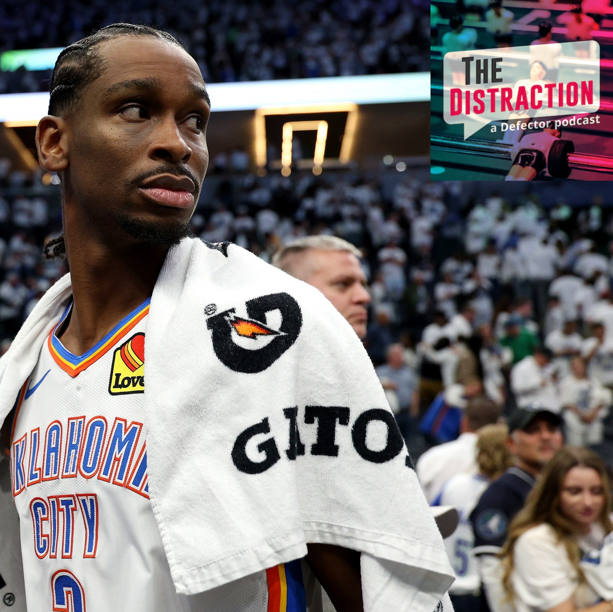 Shai Gilgeous-Alexander of the Oklahoma City Thunder looks to his right, seemingly at The Distraction logo, with a towel over his shoulder, after the team's Game 4 loss in the Western Conference Finals.