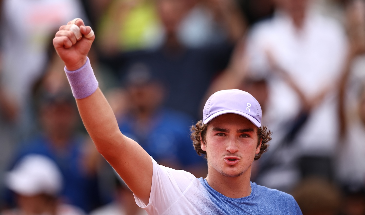 Brazil's Joao Fonseca reacts after winning against France's Pierre-Hugues Herbert during their men's singles match on day 5 of the French Open tennis tournament at the Roland-Garros Complex in Paris on May 29, 2025. (Photo by Anne-Christine POUJOULAT / AFP)