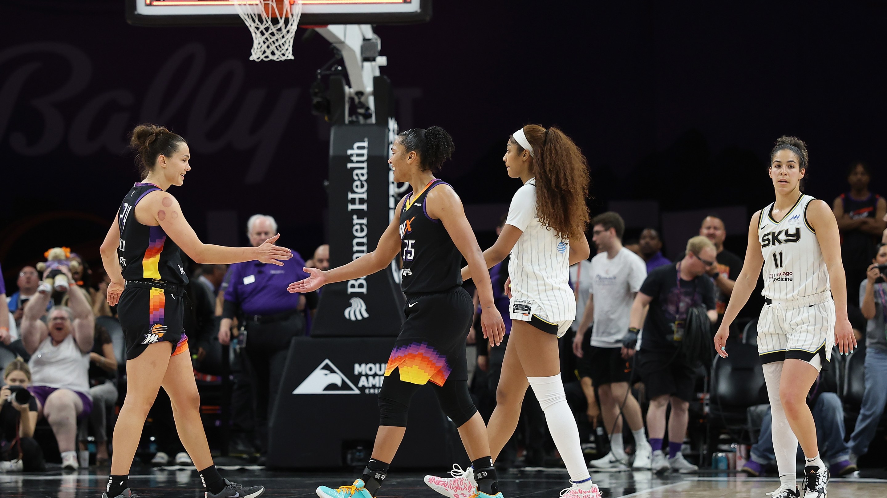 Kathryn Westbeld #24 (L) of the Phoenix Mercury celebrates with Alyssa Thomas #25 after defeating the Chicago Sky 94-89 in the WNBA game at PHX Arena on May 27, 2025 in Phoenix, Arizona.